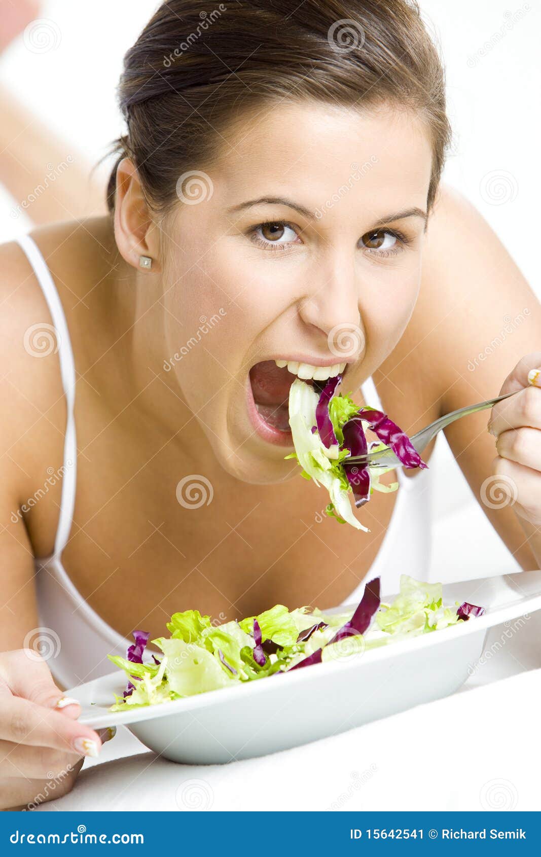 Woman eating salad stock image. Image of vegetarian, holding 15642541