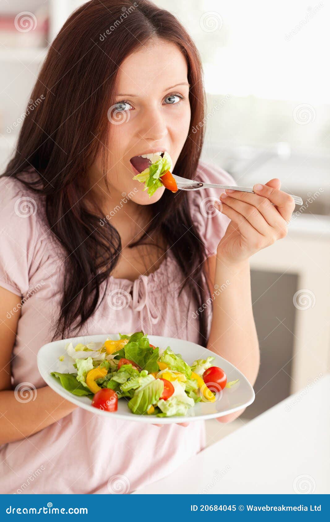 Woman eating salad stock image. Image of natural, beautiful 20684045