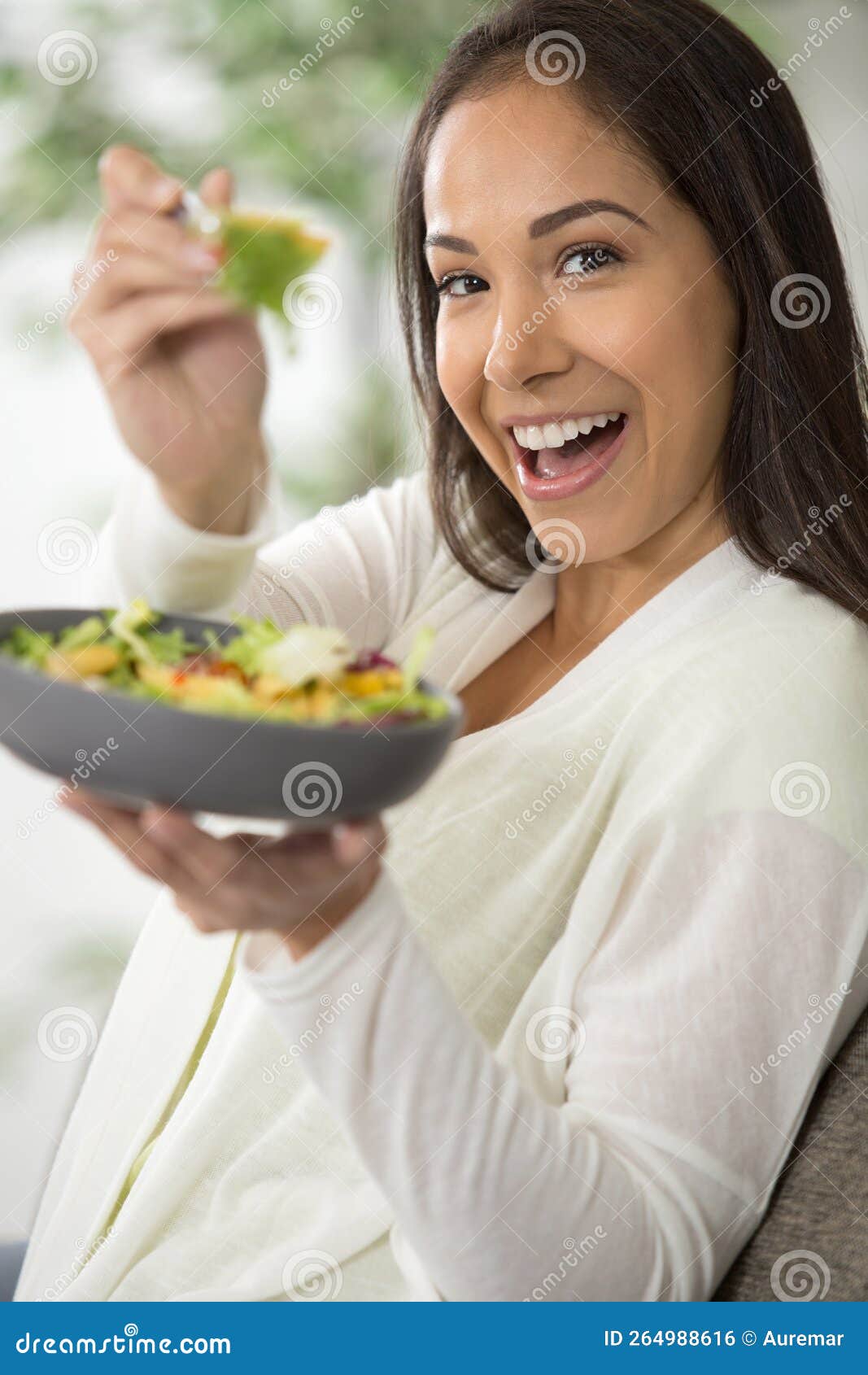 Woman Eating Salad and Smiling Stock Photo Image of kitchen, home