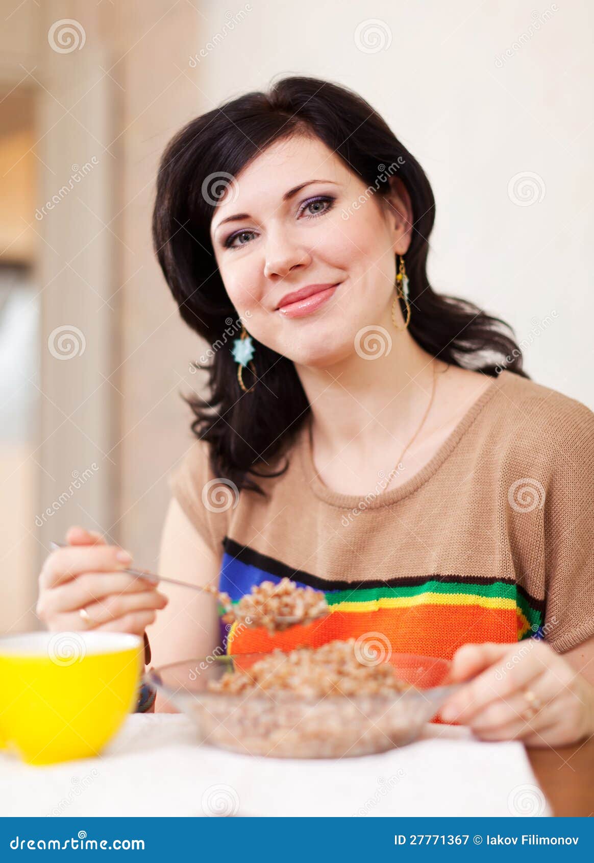 Woman eats buckwheat stock image. Image of indoors, care 27771367