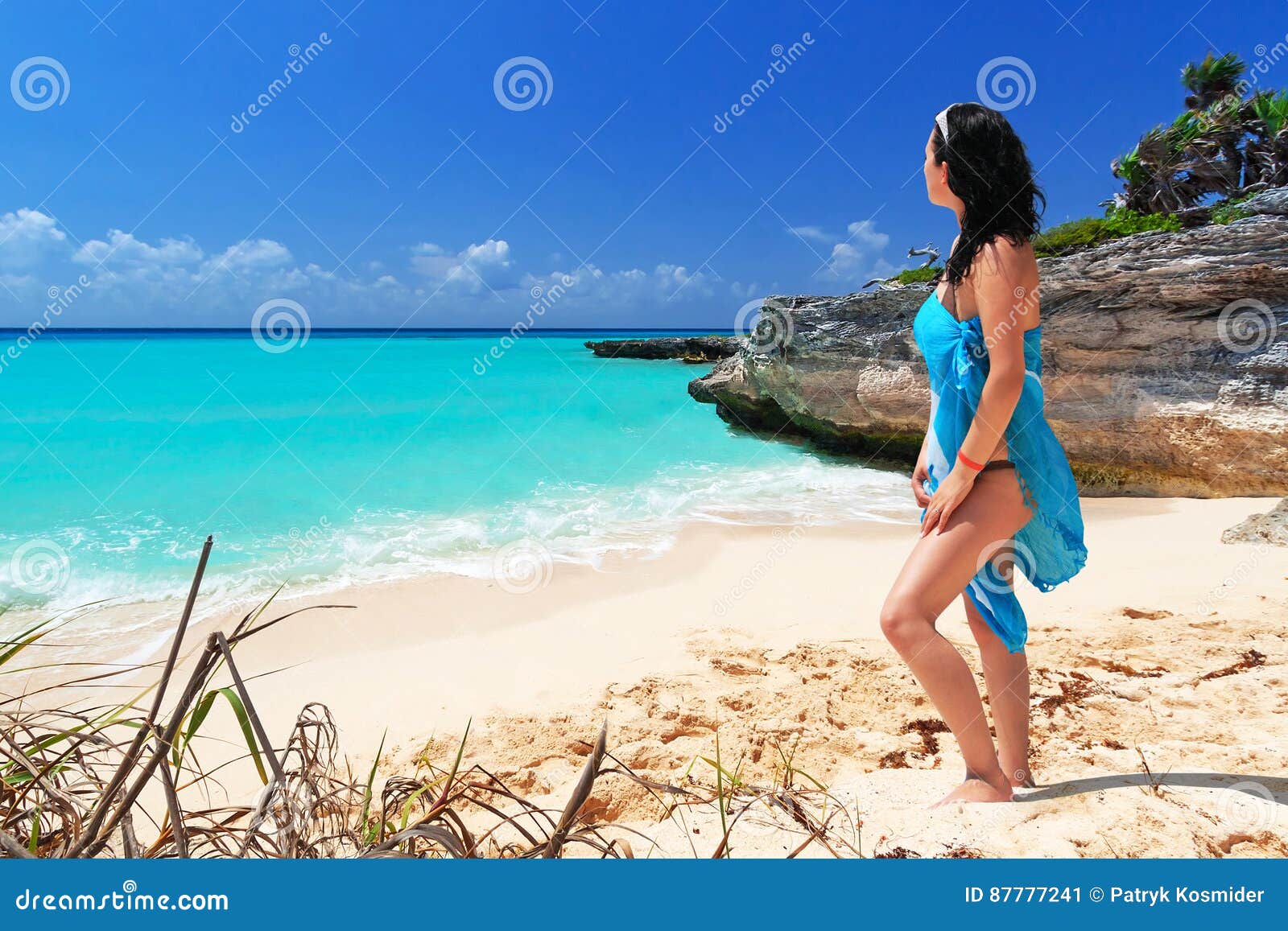 woman enjoing sun holidays at the beach