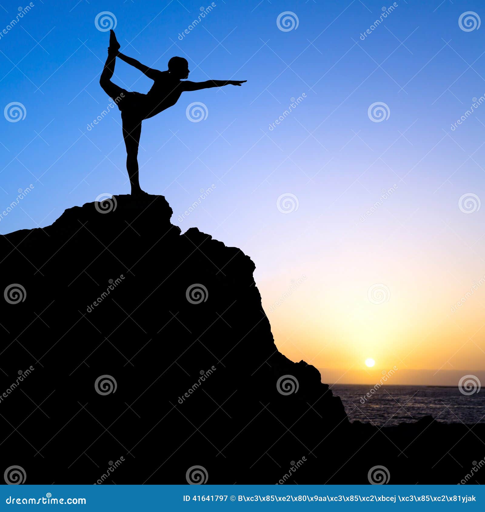 Meditation on sunset sky background. Young active woman in yoga