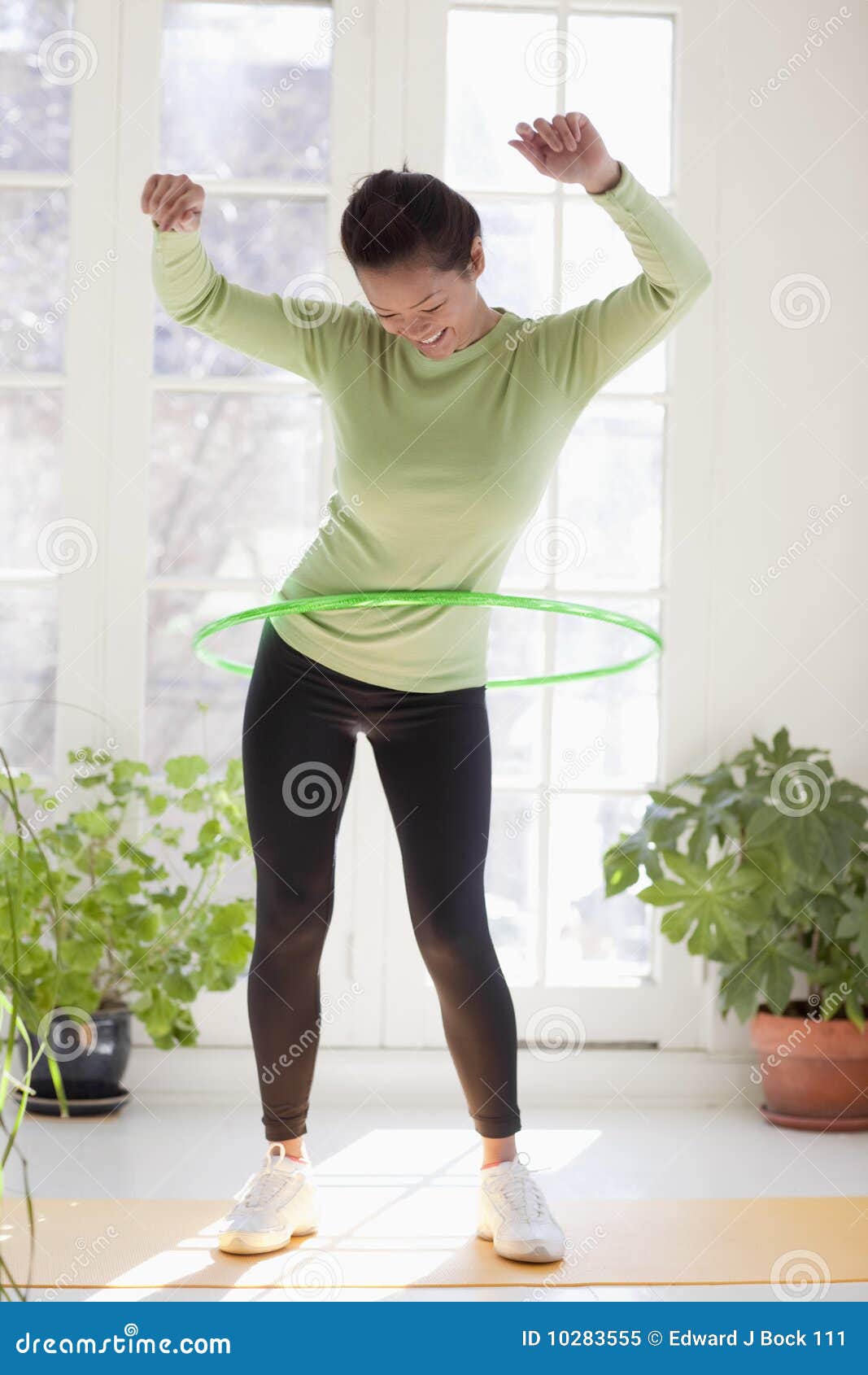 woman exercising with hula hoop