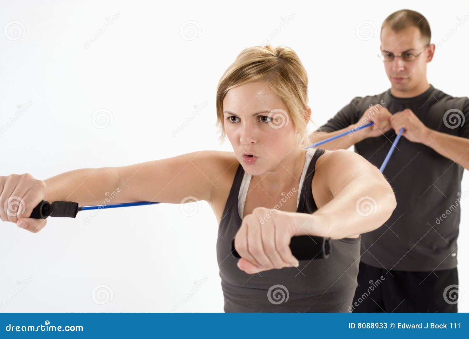 woman exercising with personal trainer