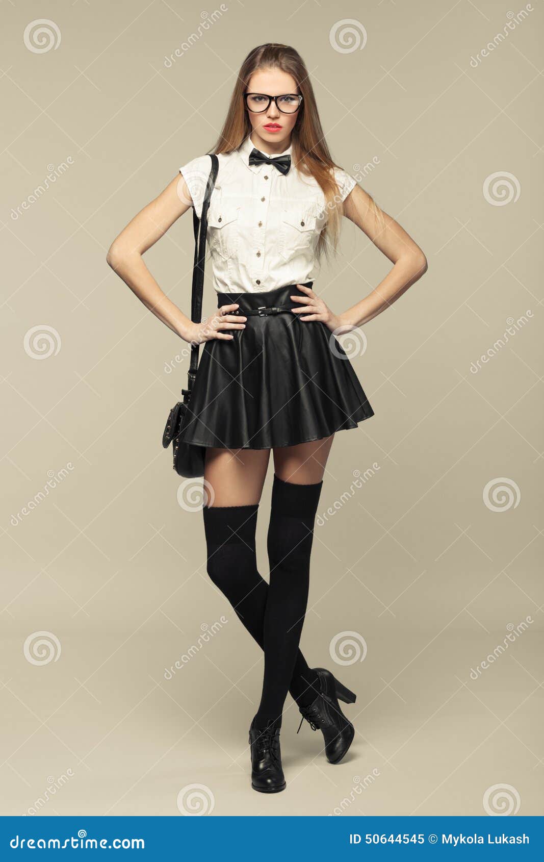 Woman Is In Fashion Style In Black Mini Skirt. Fashion 