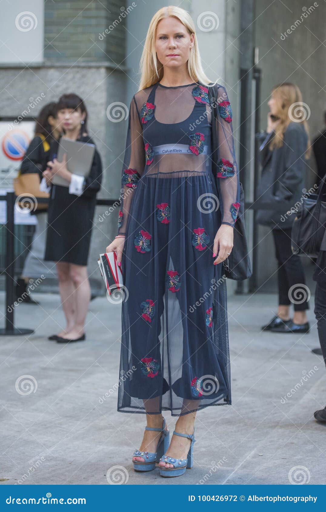 Premium Photo | Fashionable woman poses at the gucci fashion show during  milan women's fashion week in milan