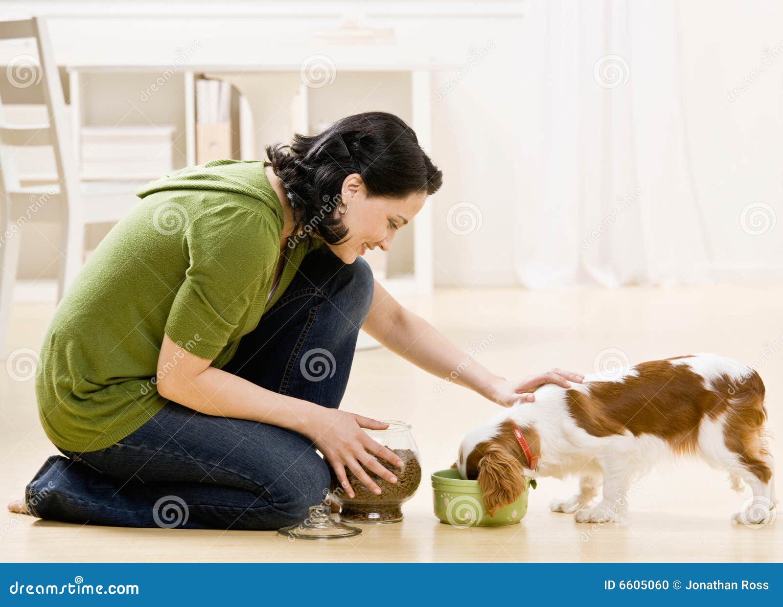 woman feeding dog