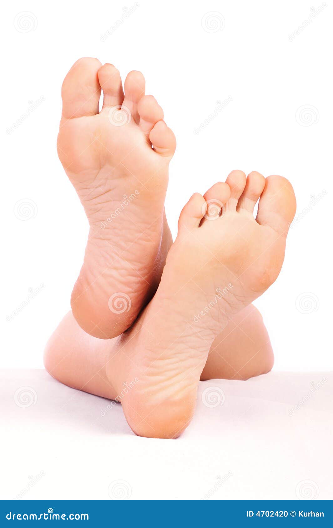 Beautiful woman feet. Isolated over white background