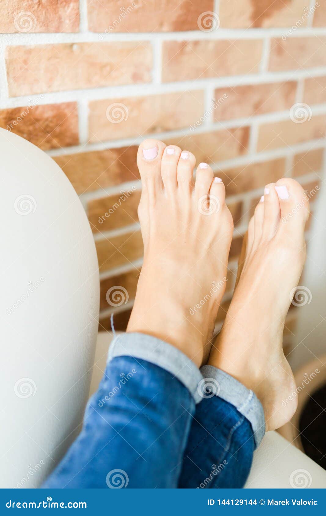 Woman Feet in Details, Bare Feet in Comfortable Position Stock Photo