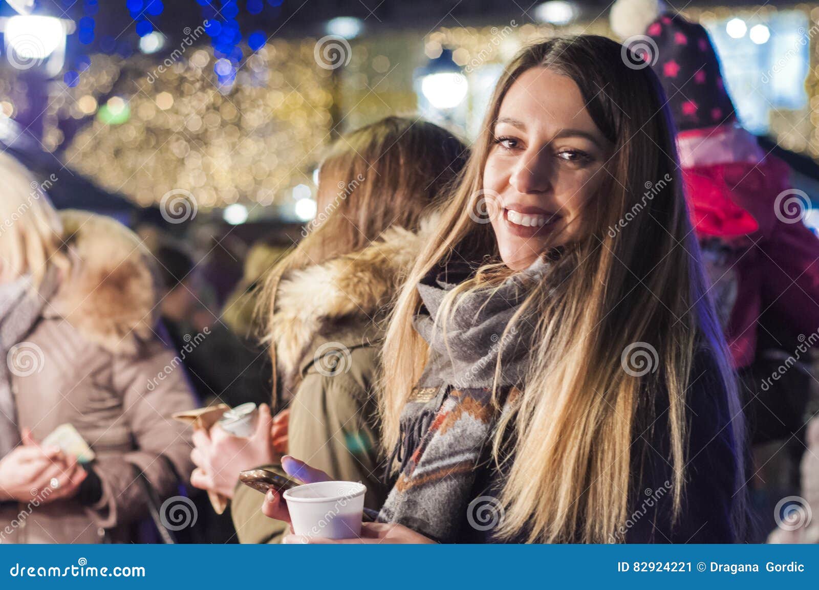 Woman on the Festive Christmas Market at Night. Happy Woman Feeling the ...