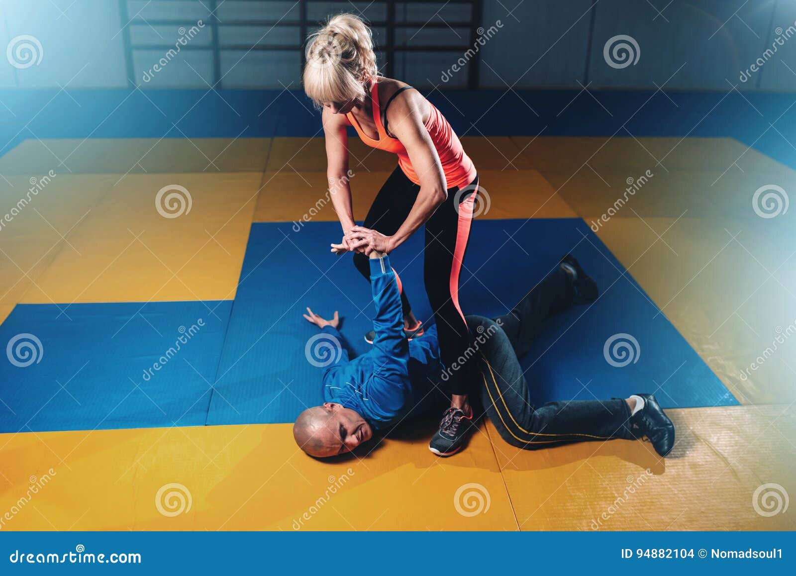 woman fights with man, self-defense technique