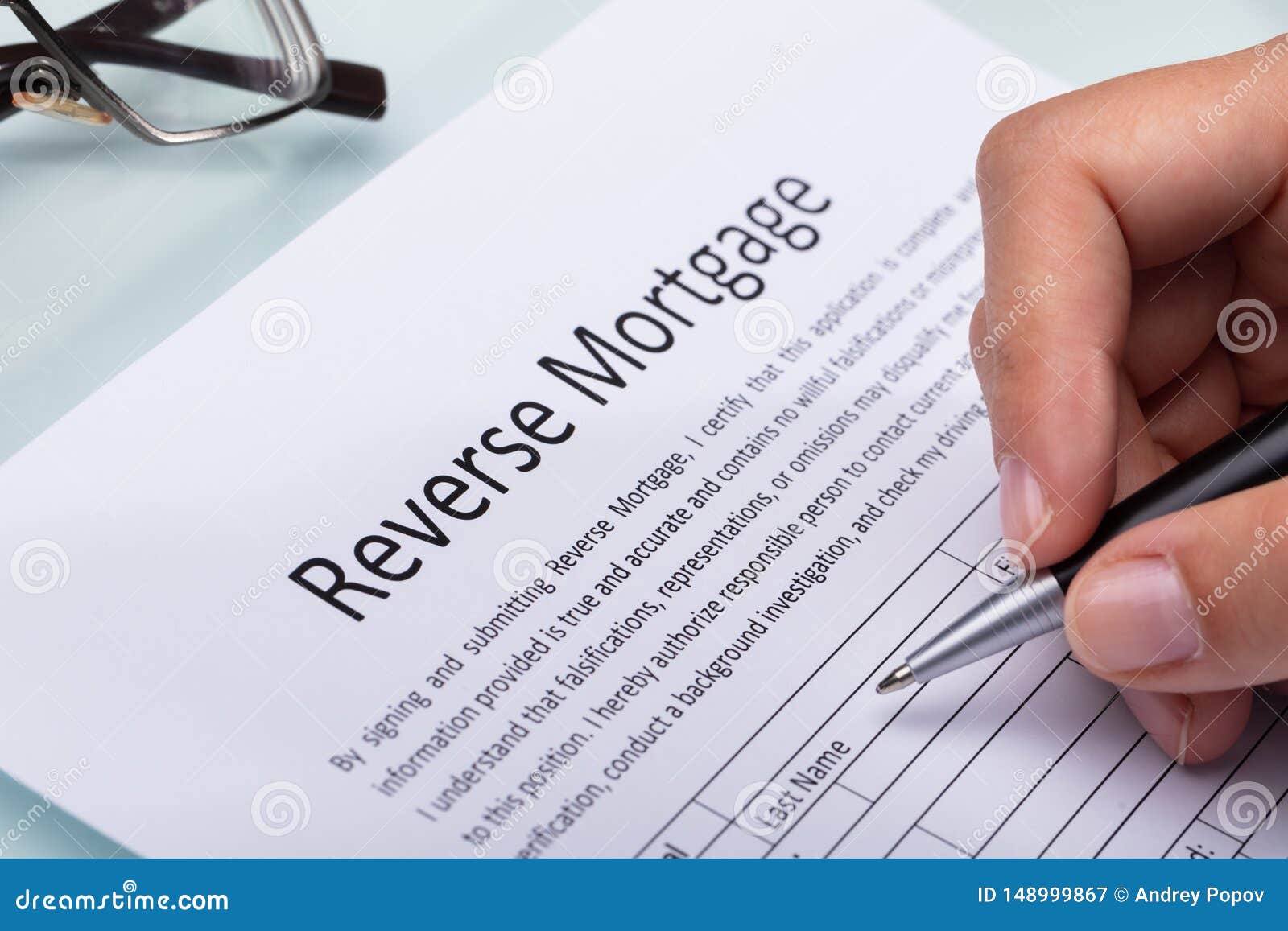 woman filling reverse mortgage form