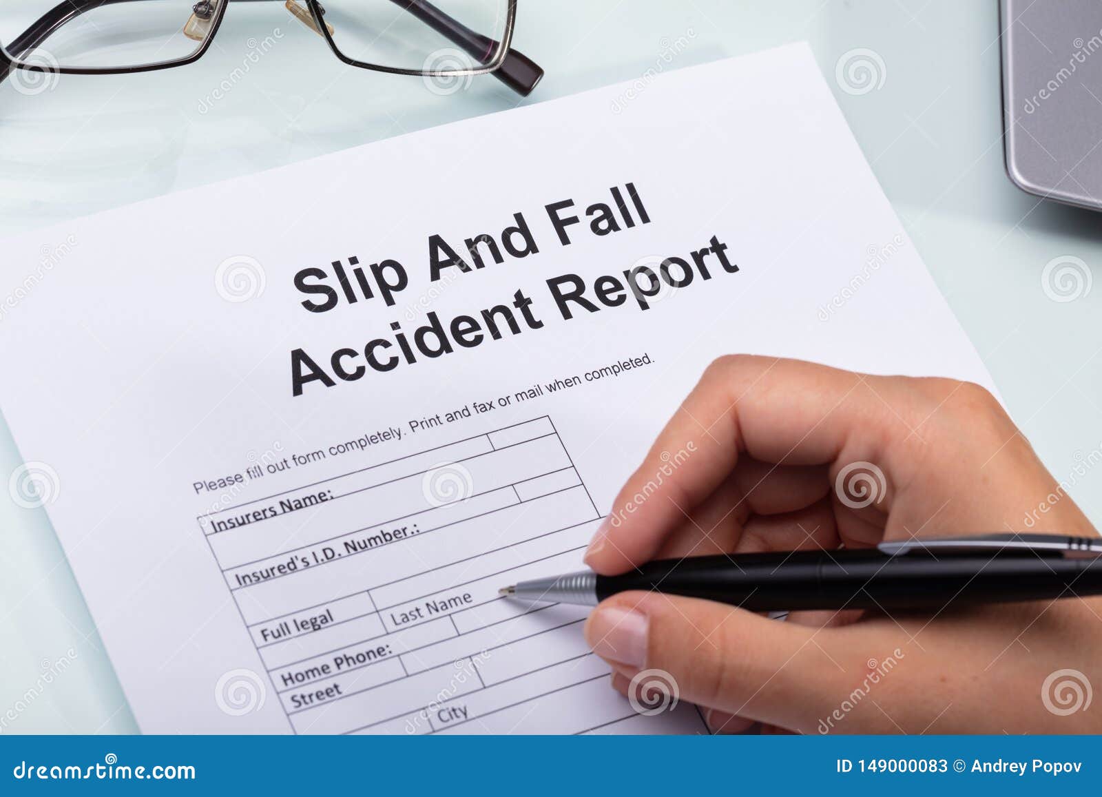 woman filling slip and fall accident report