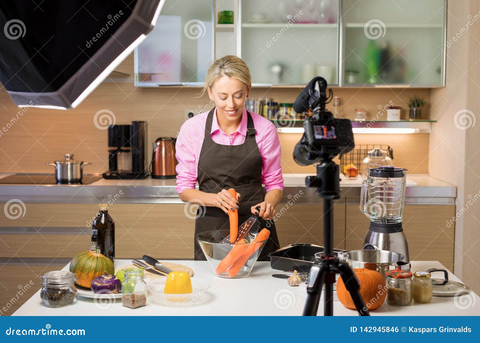 woman filming cooking vlog. concept of vlogging, blogging and content creation