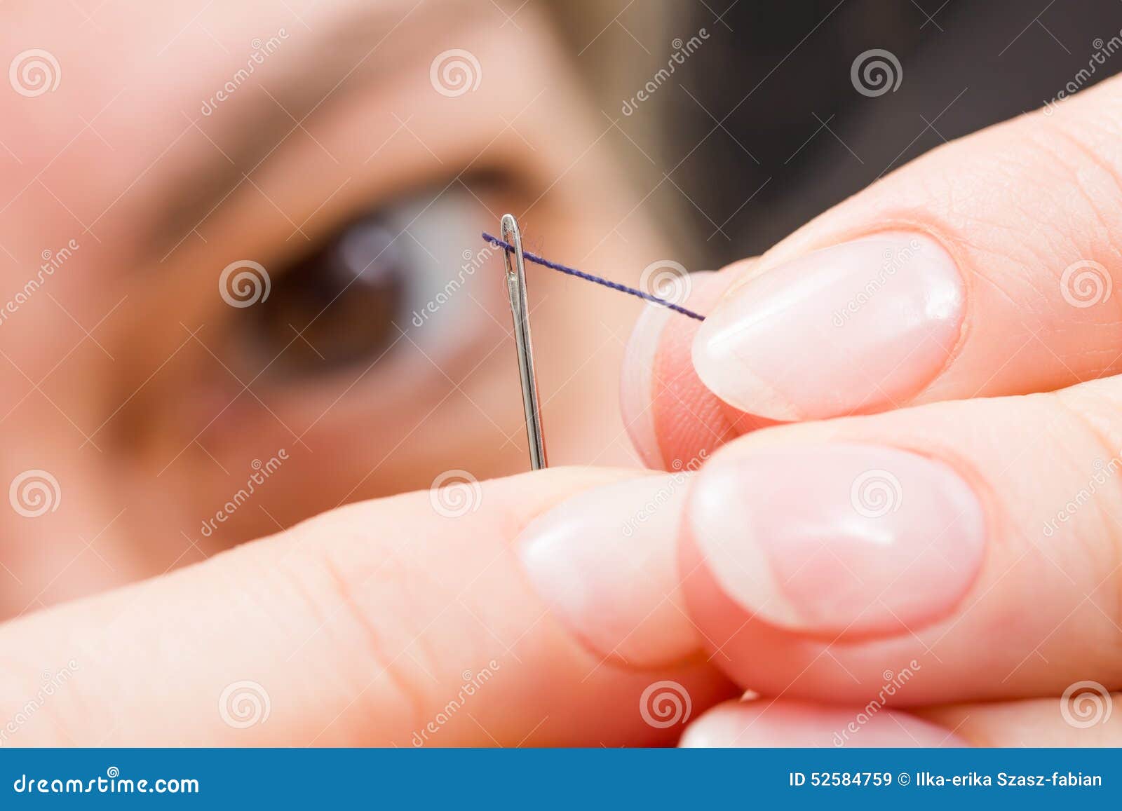 Man Threading A Needle Stock Photo 46665804