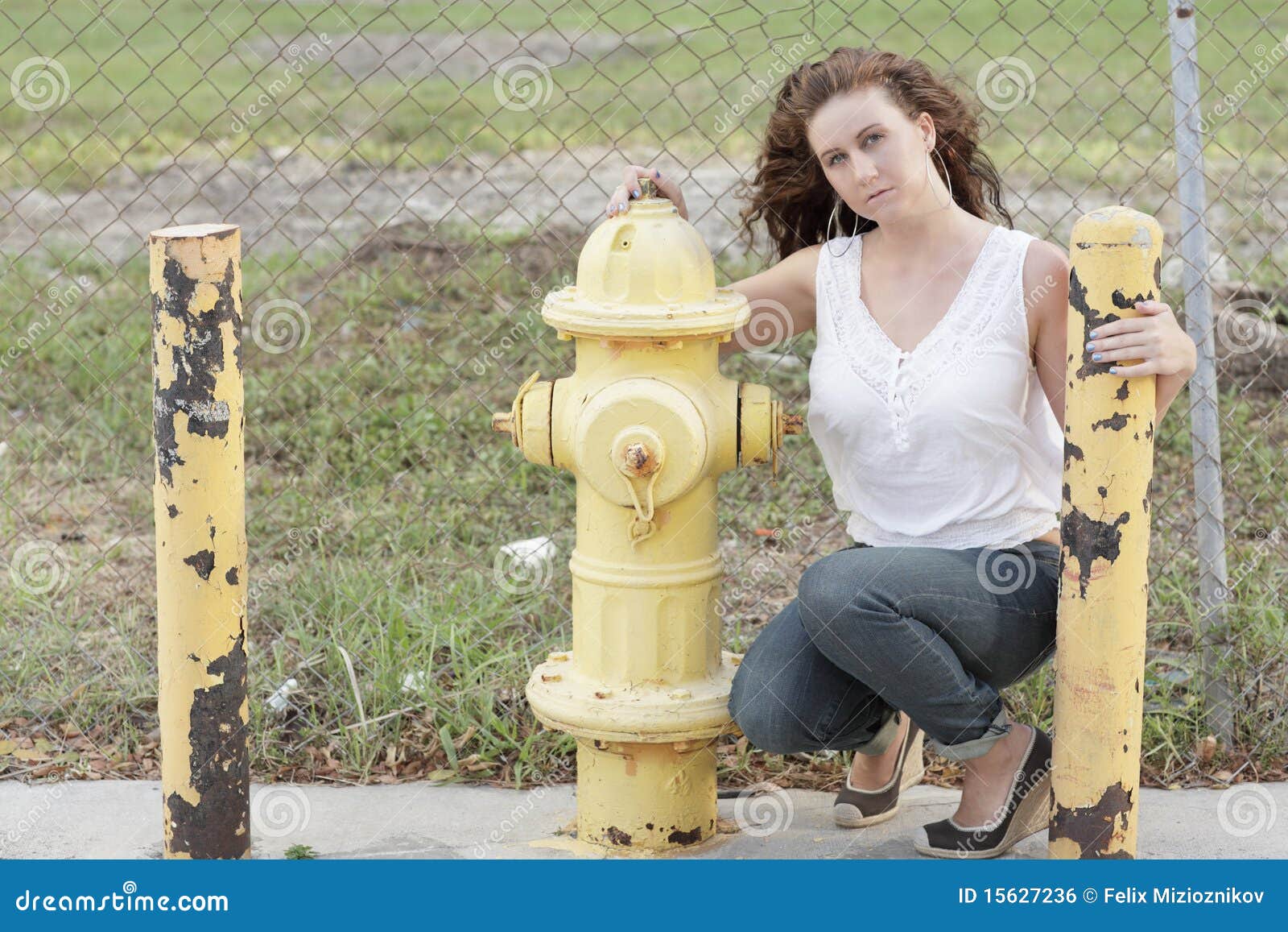 Woman by a fire hydrant stock photo. Image of person 15627236