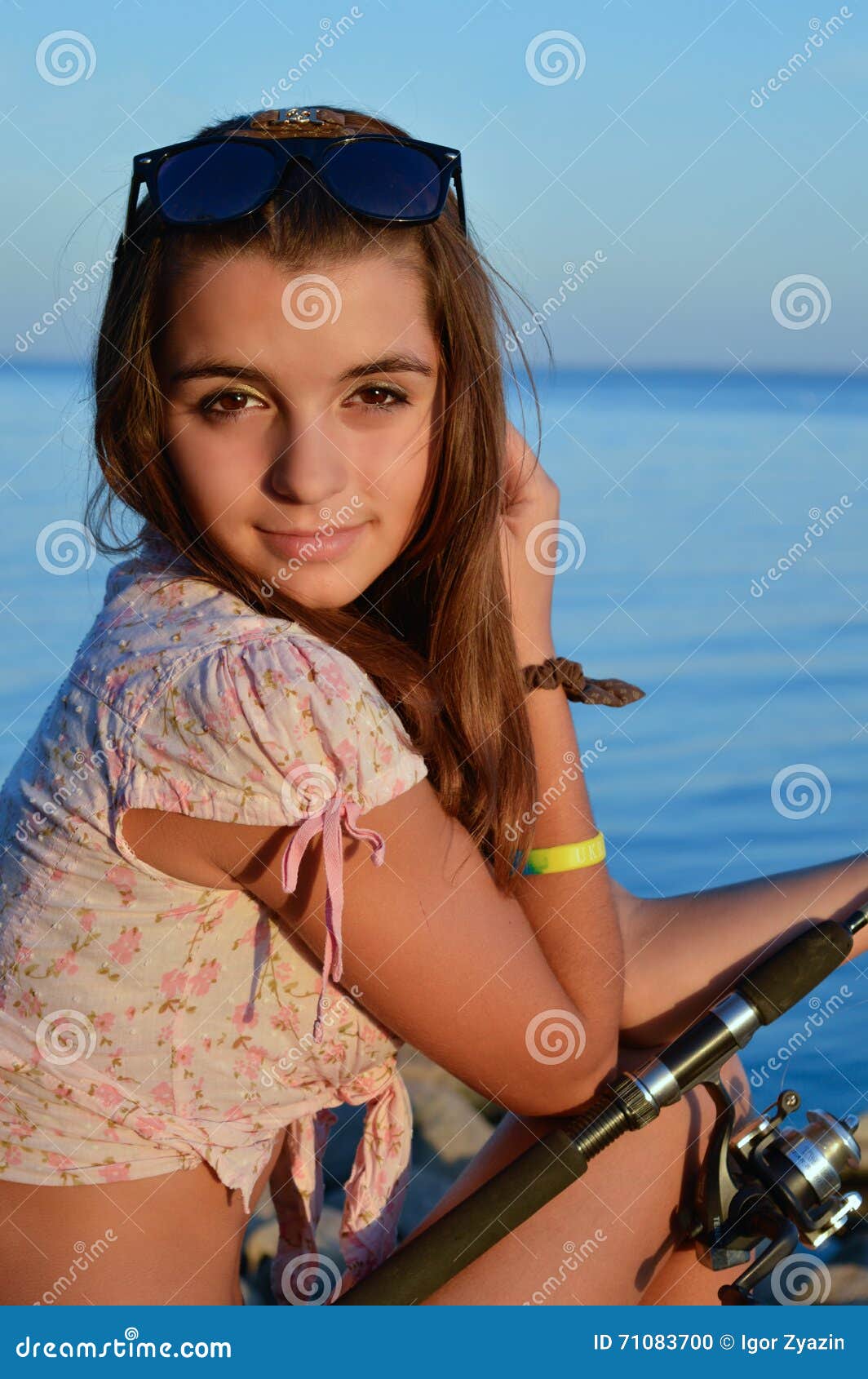 Woman fishing at sea stock photo. Image of catch, gold - 71083700