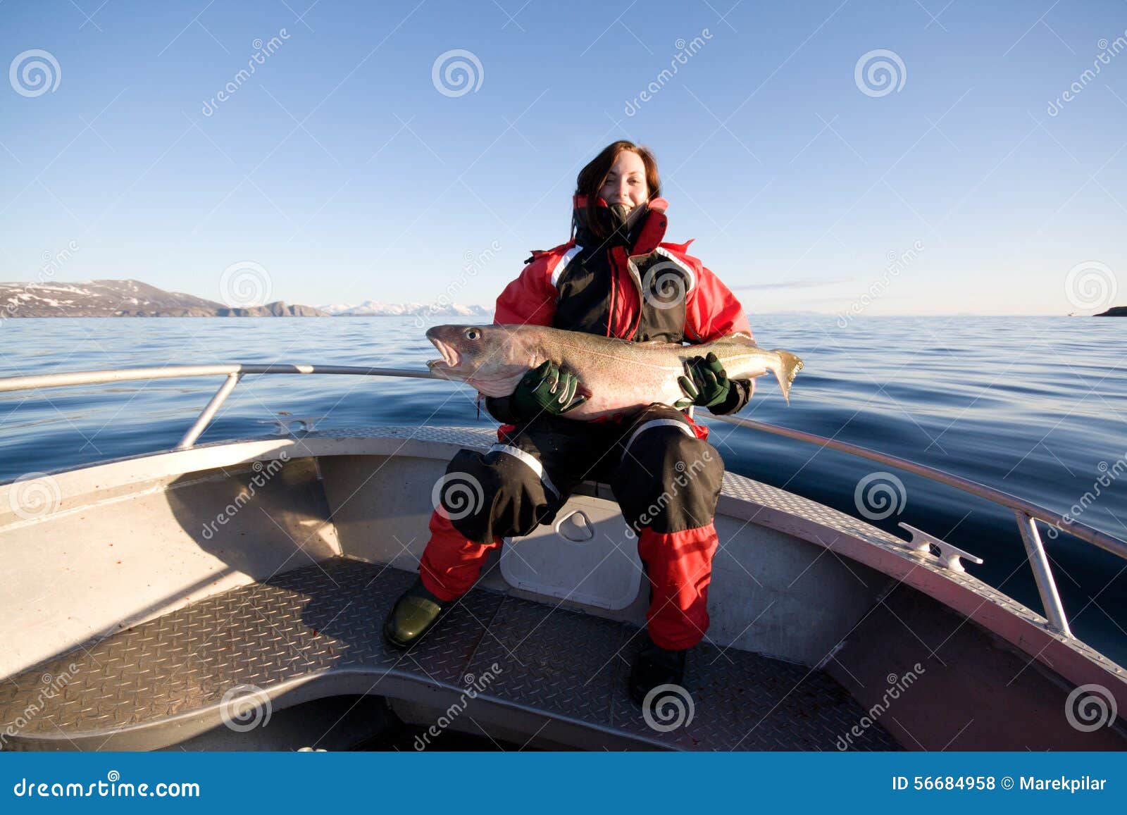 https://thumbs.dreamstime.com/z/woman-fishing-womanholding-trophy-fish-boat-sea-norway-56684958.jpg