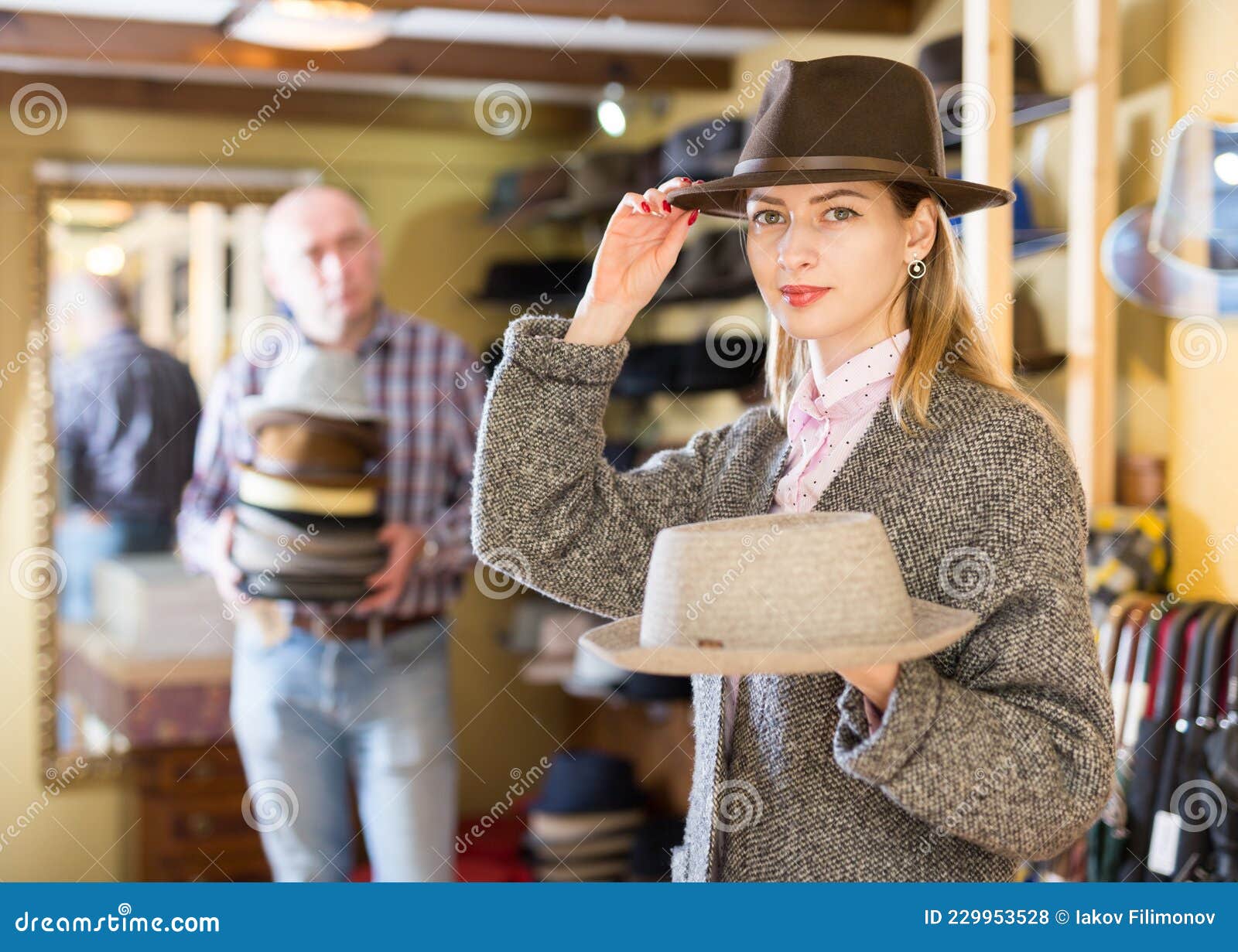 Woman Fitting on Classic Hat in Shop Stock Photo - Image of shopping ...
