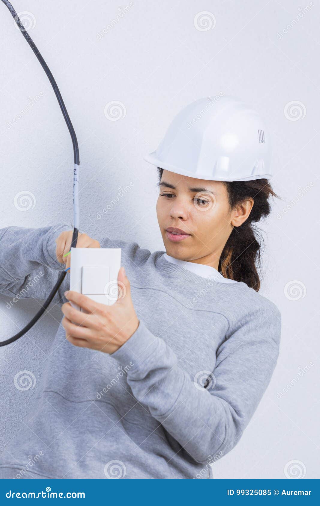 Woman Fitting Electrical Outlet in Bathroom Stock Image - Image of