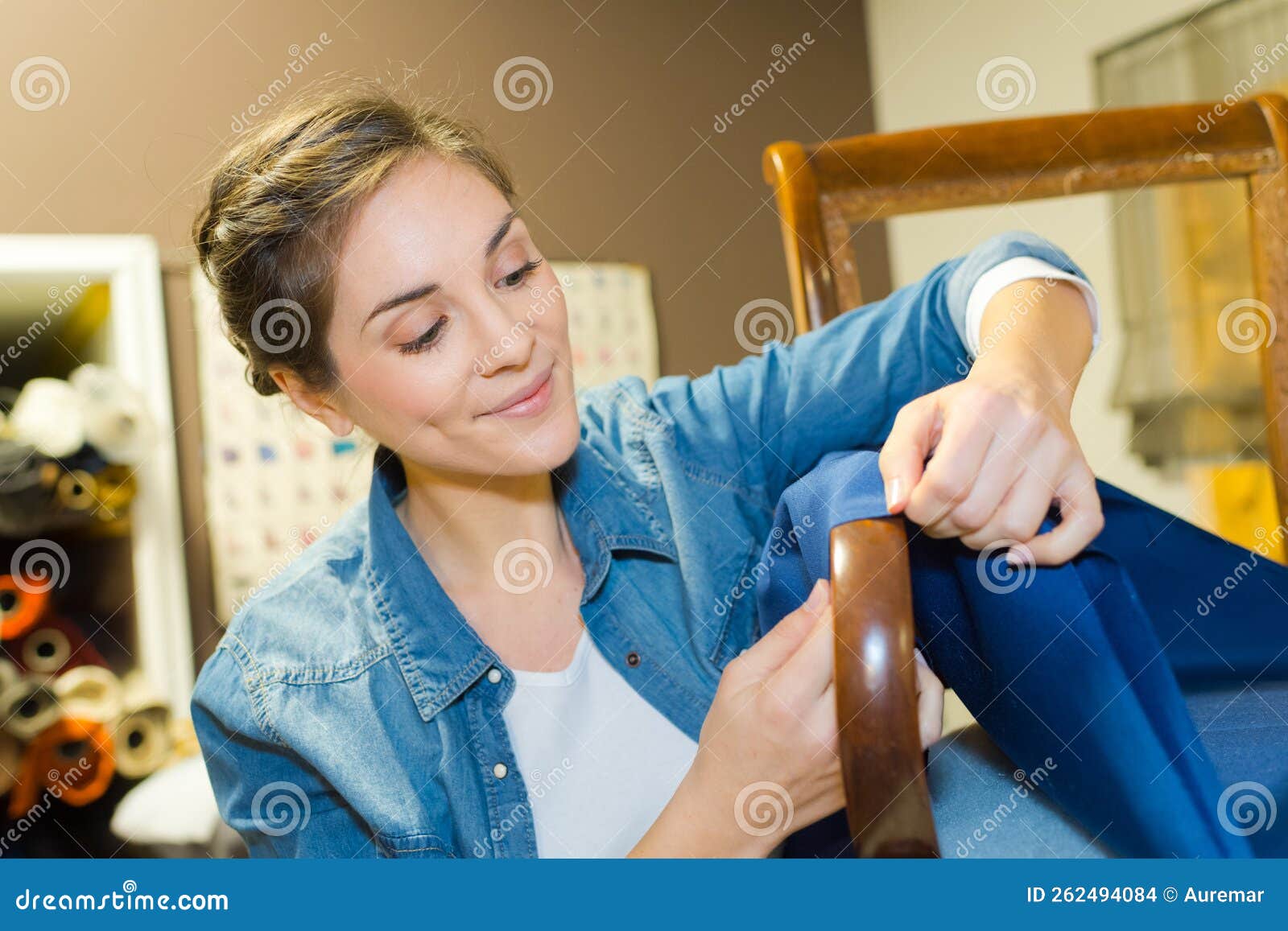 Woman fixing a chair stock photo. Image of professional 262494084