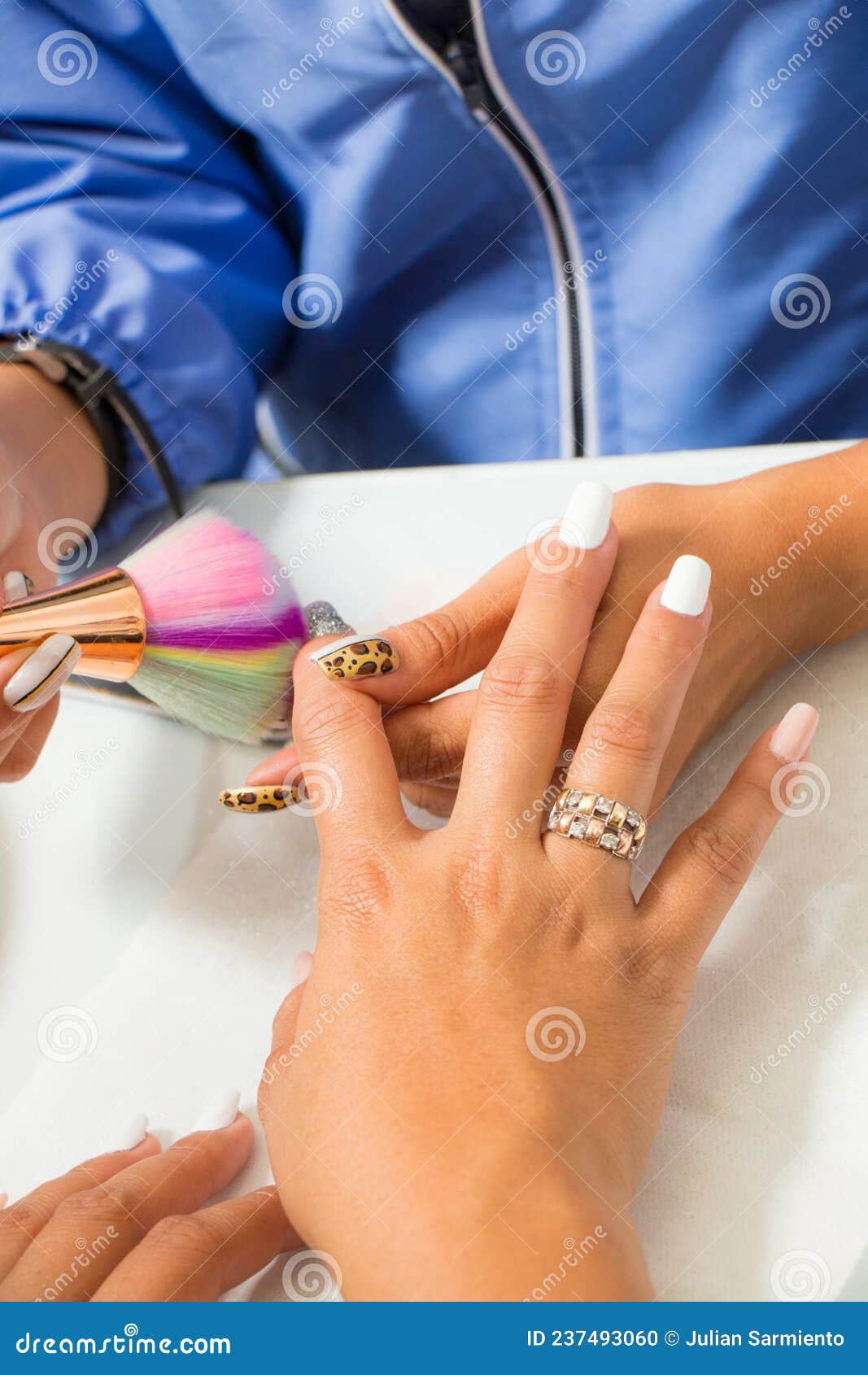 fixing her nail polish