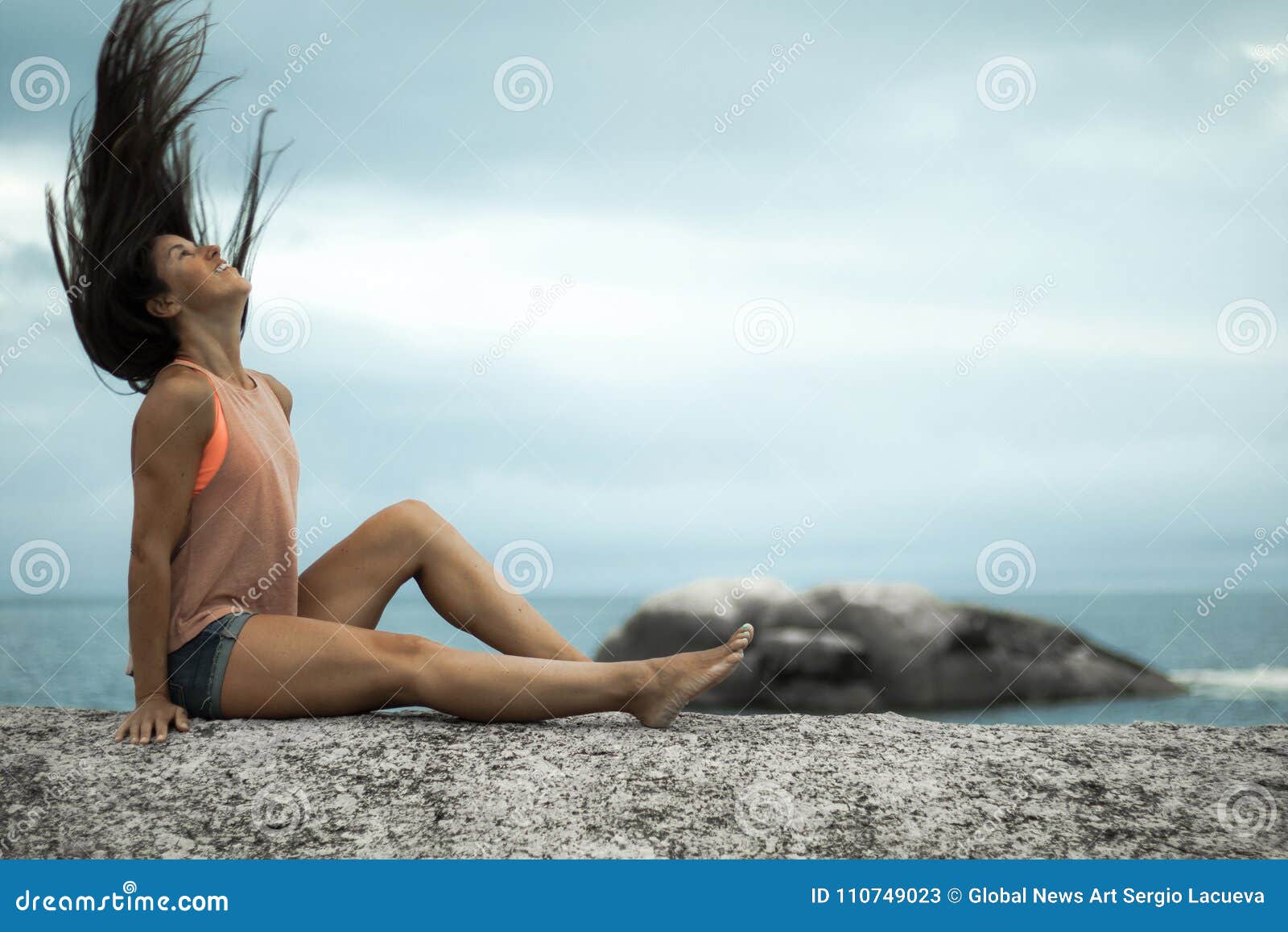 Woman Flicking Her Hair On A Rock At Sunset On Bakovern Beach Cape Town Stock Image Image Of