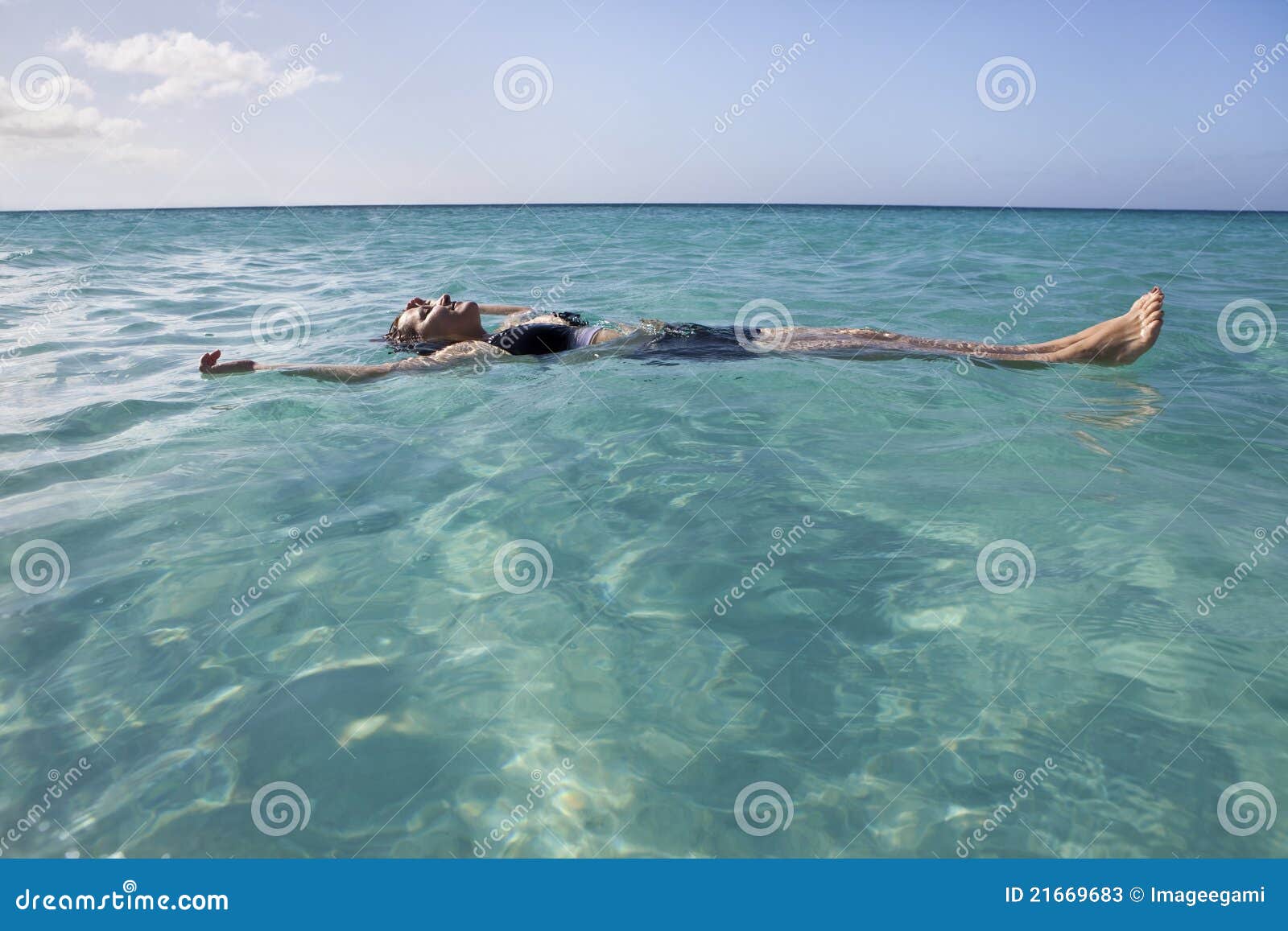 woman floating and relaxing in the sea