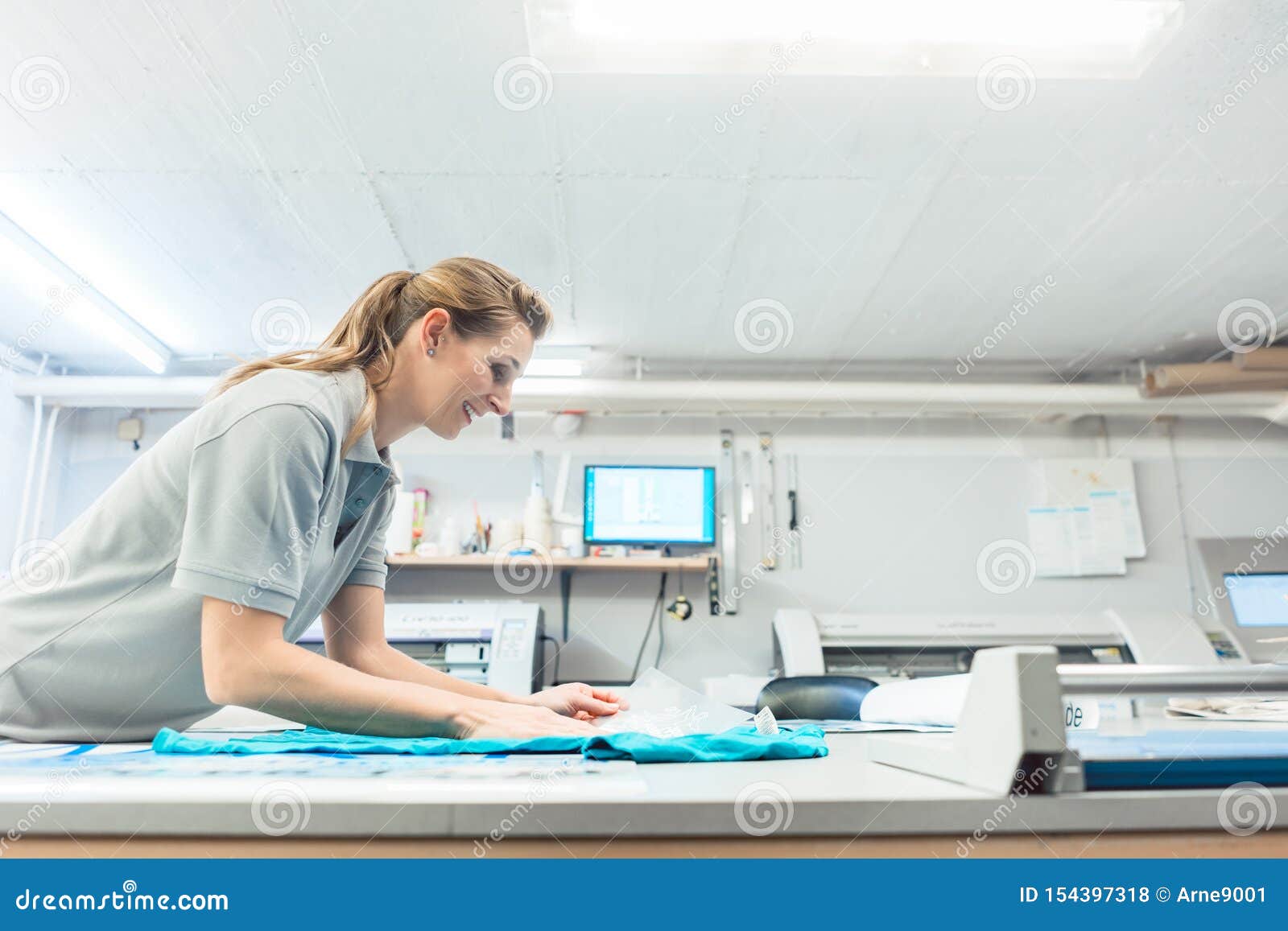 Woman Flock Printing a T-shirt As Promotional Item Stock Photo - Image