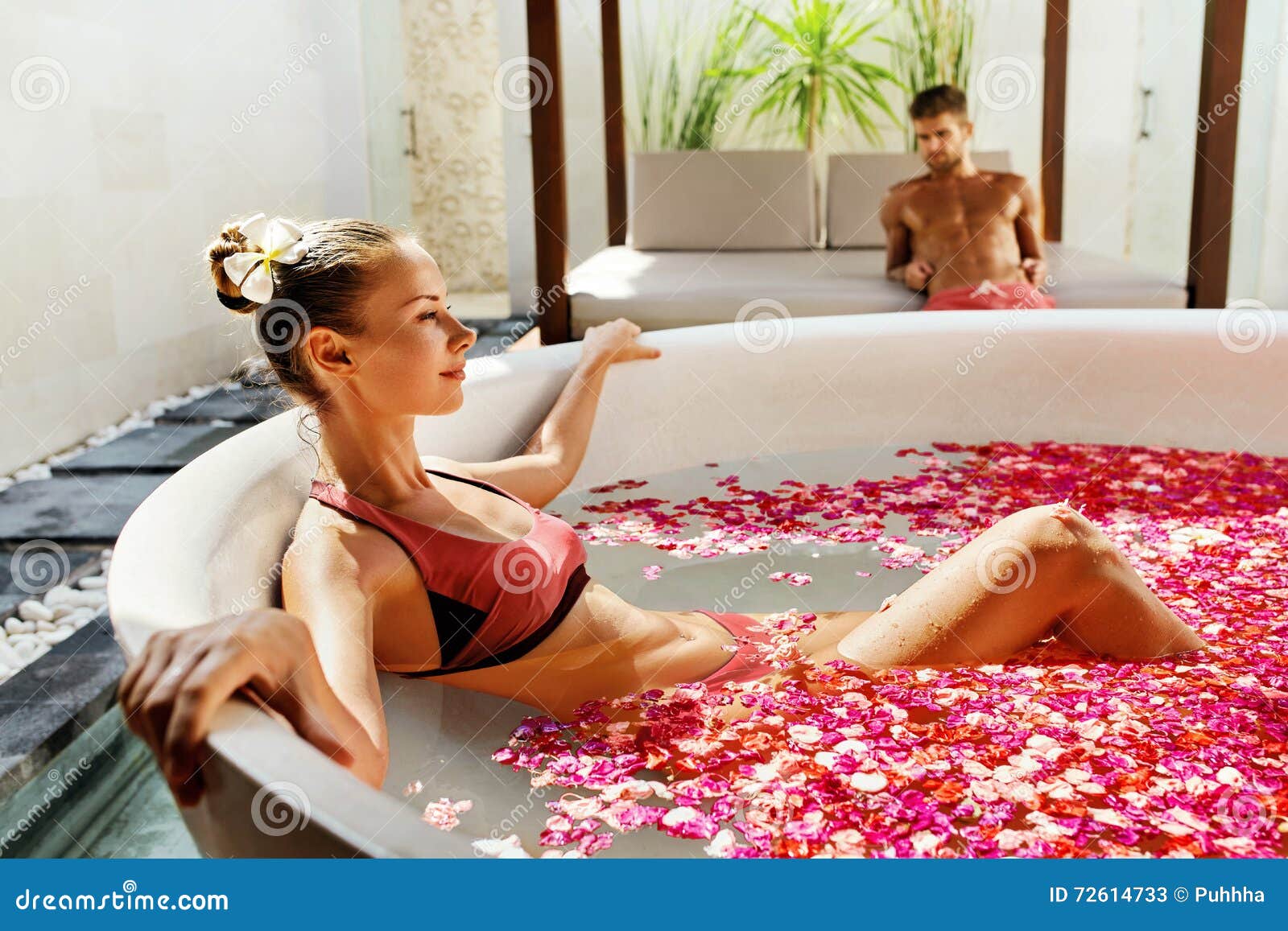 Woman in Flower Bath at Day Spa Salon Stock Image photo