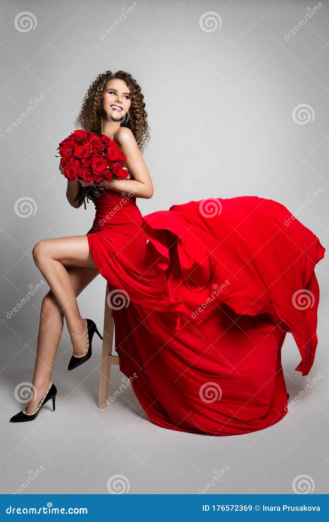 Woman with Flowers Roses in Red Dress Flying on Wind, Beautiful ...