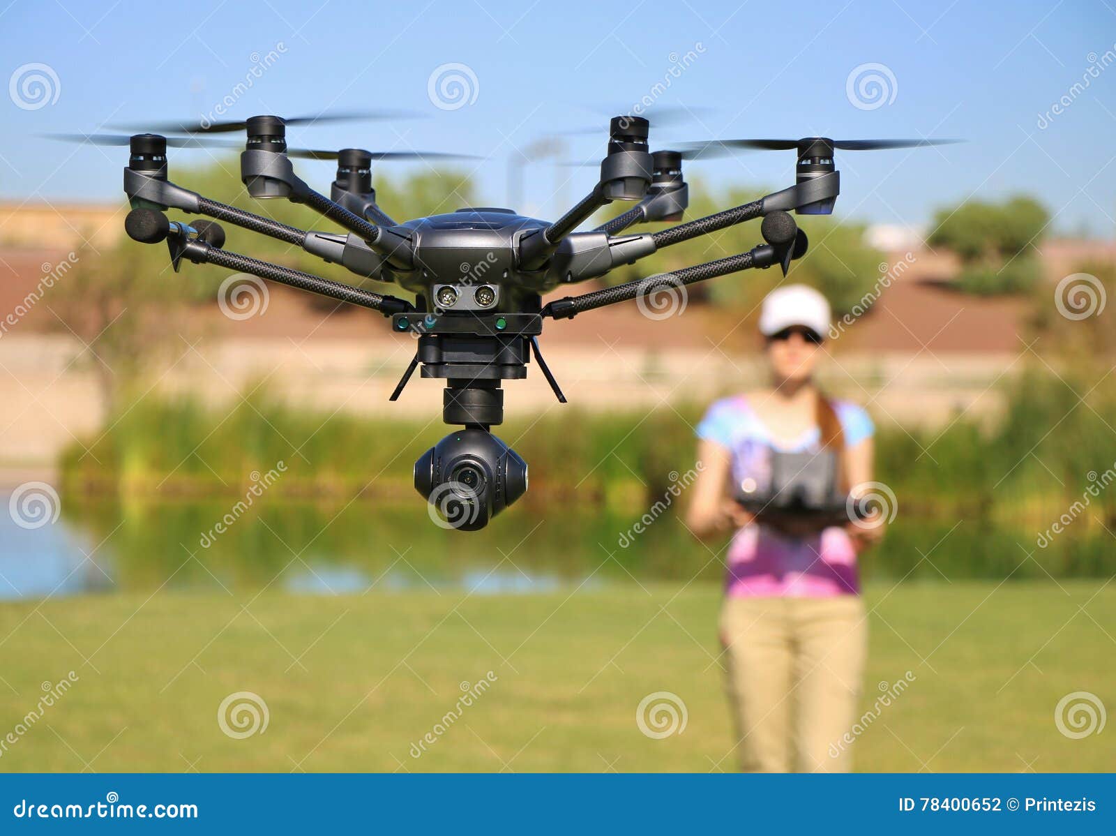 woman flying high-tech camera drone (large file)