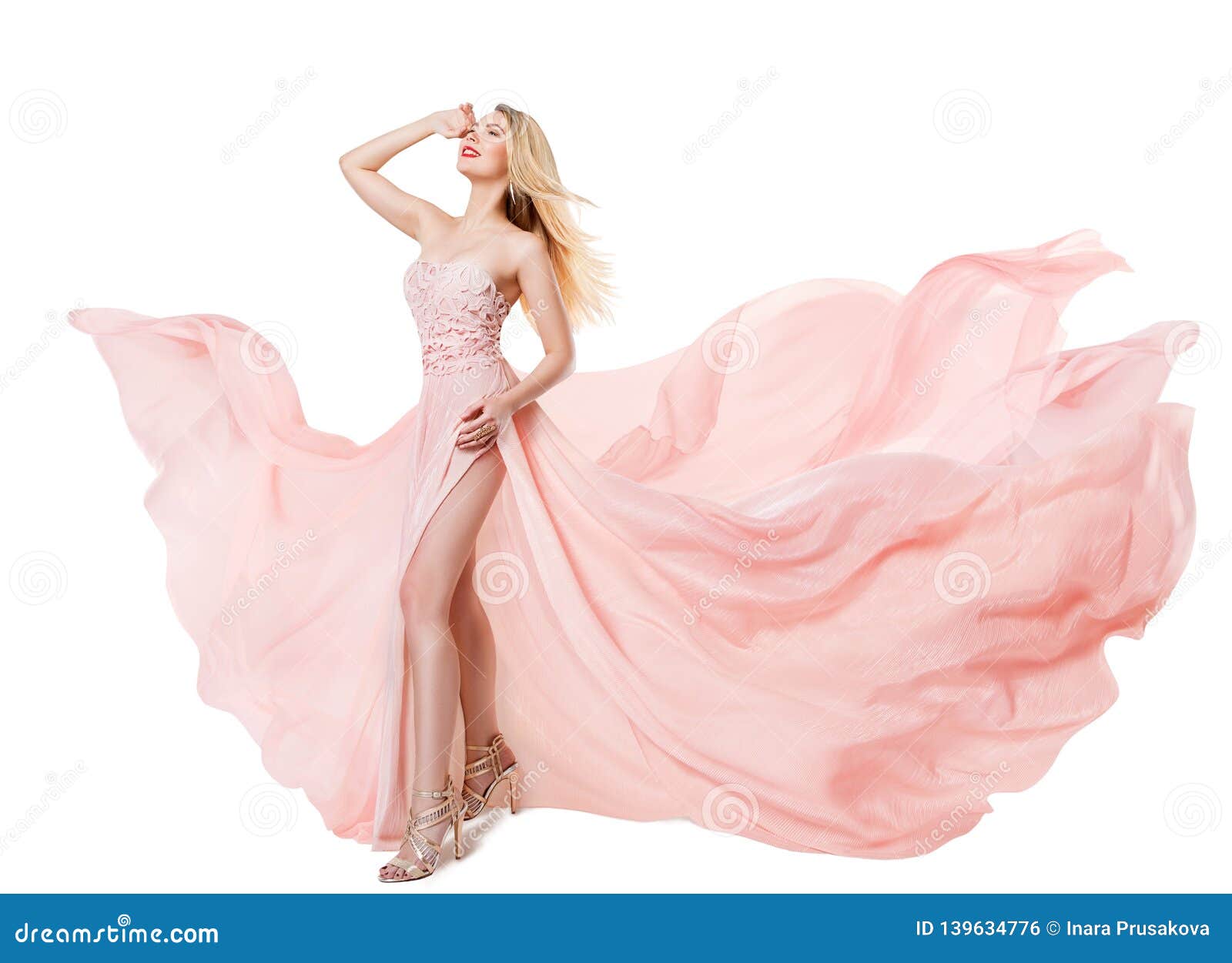 woman flying pink dress, fashion model in long waving gown, fluttering fabric