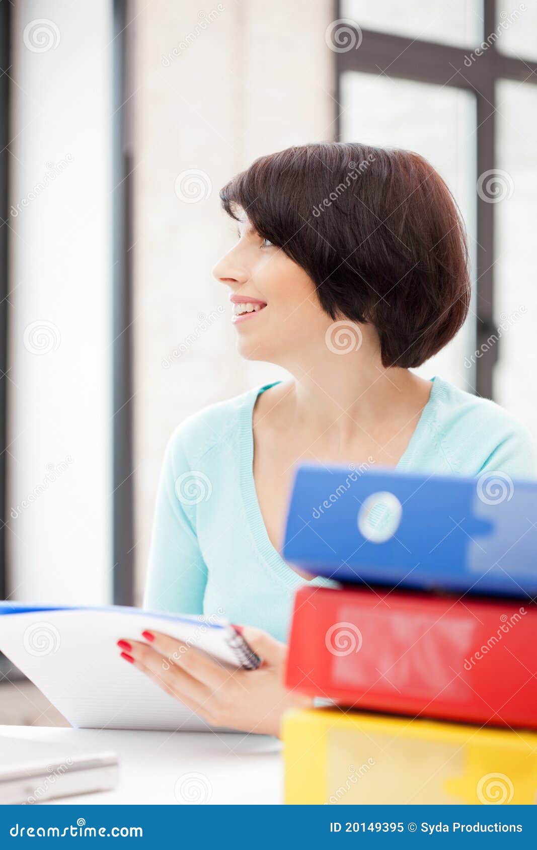 Bright picture of beautiful woman with folders