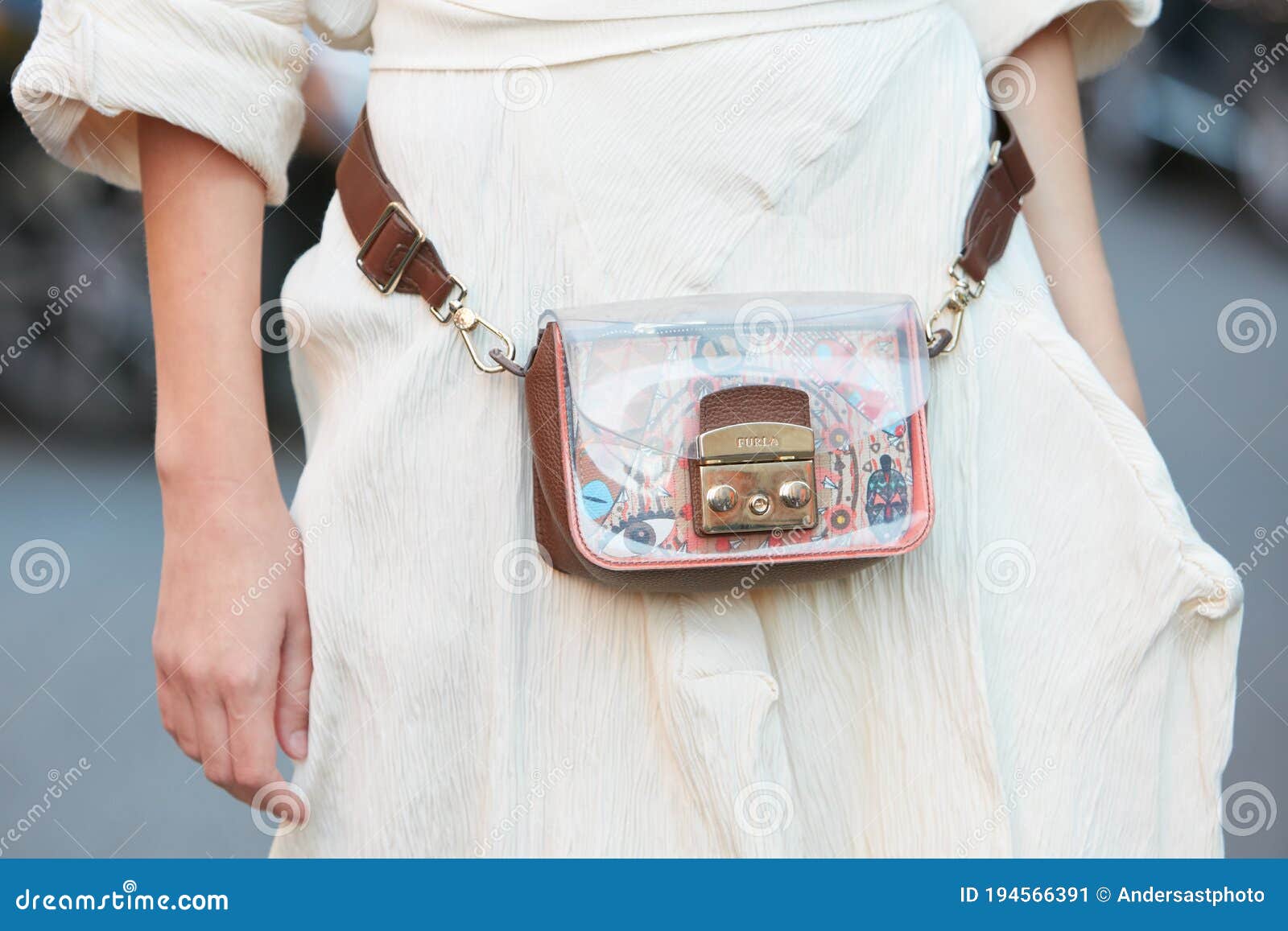 Woman with white Louis Vuitton square bag before Gucci fashion show, Milan  Fashion Week street style on September 21, in Milan Stock Photo - Alamy
