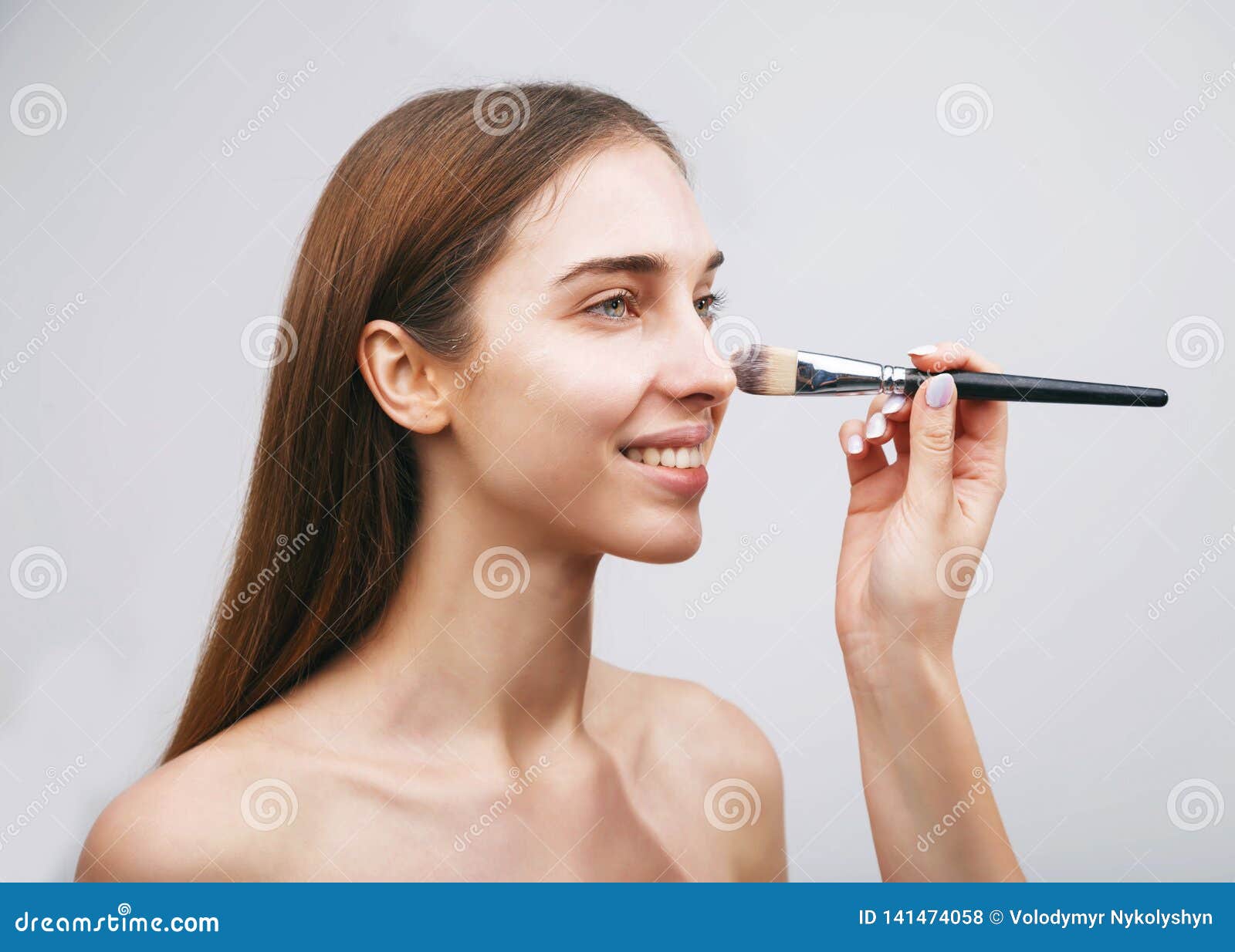 woman getting makeup