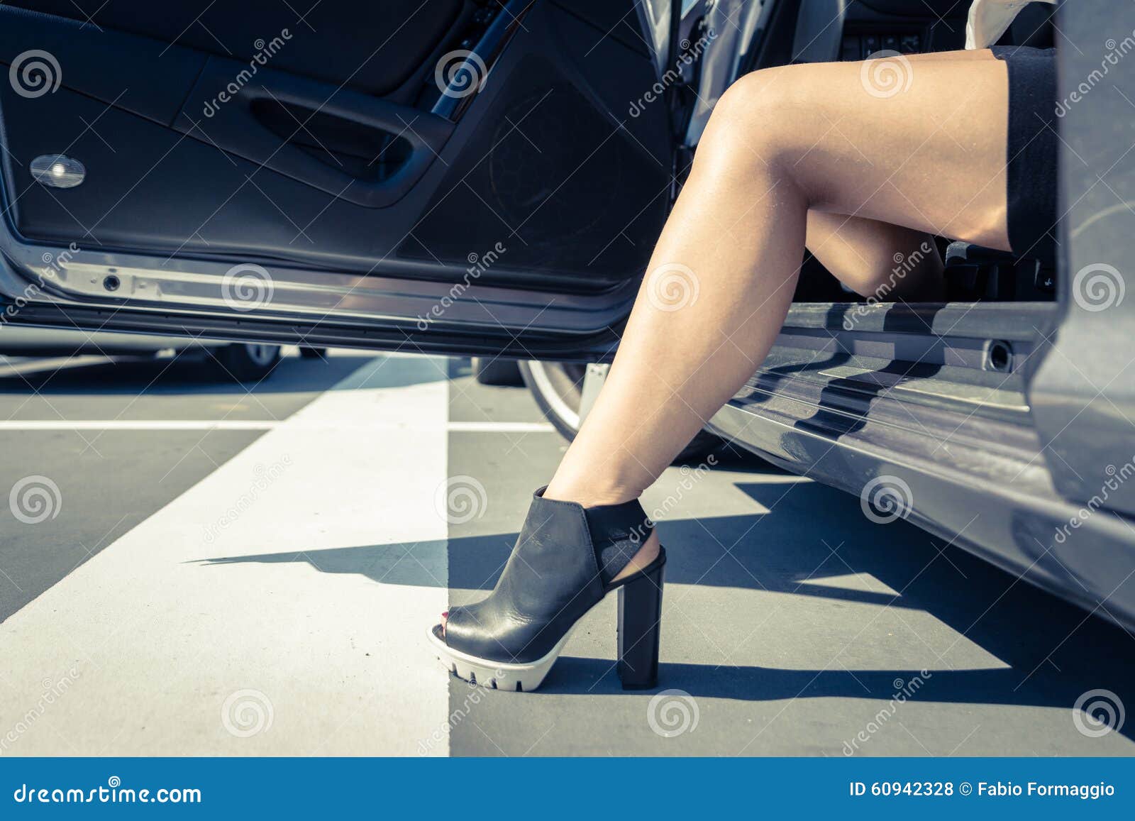 woman getting out the car.