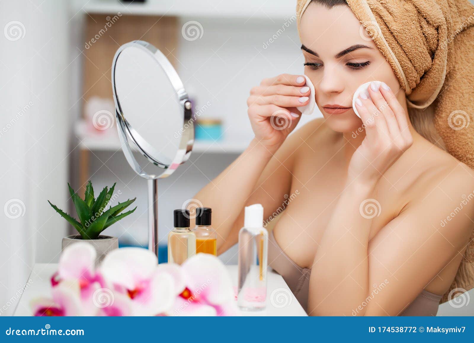 woman getting ready for work over bathroom sink