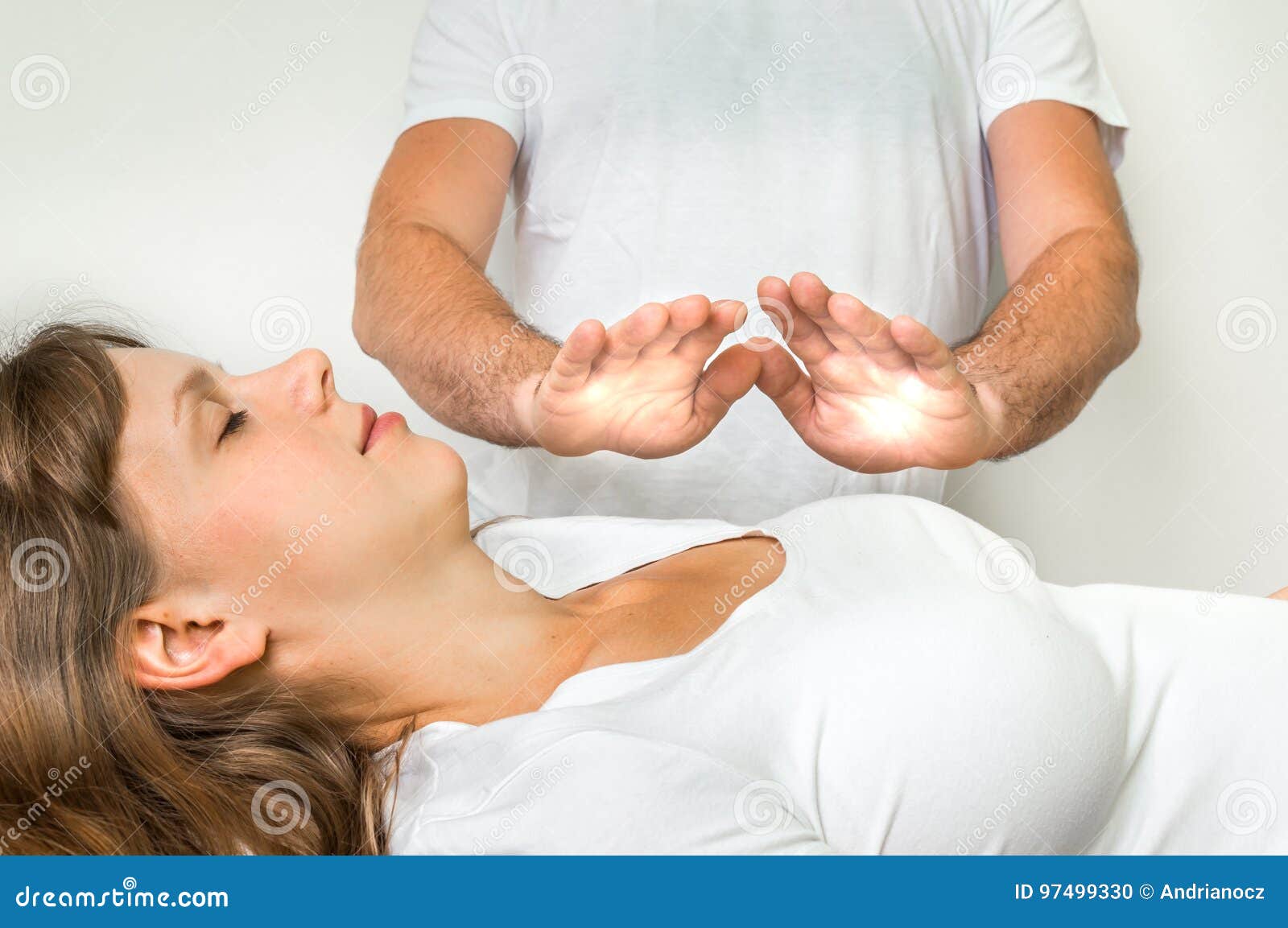 woman getting reiki healing therapy - alternative medicine