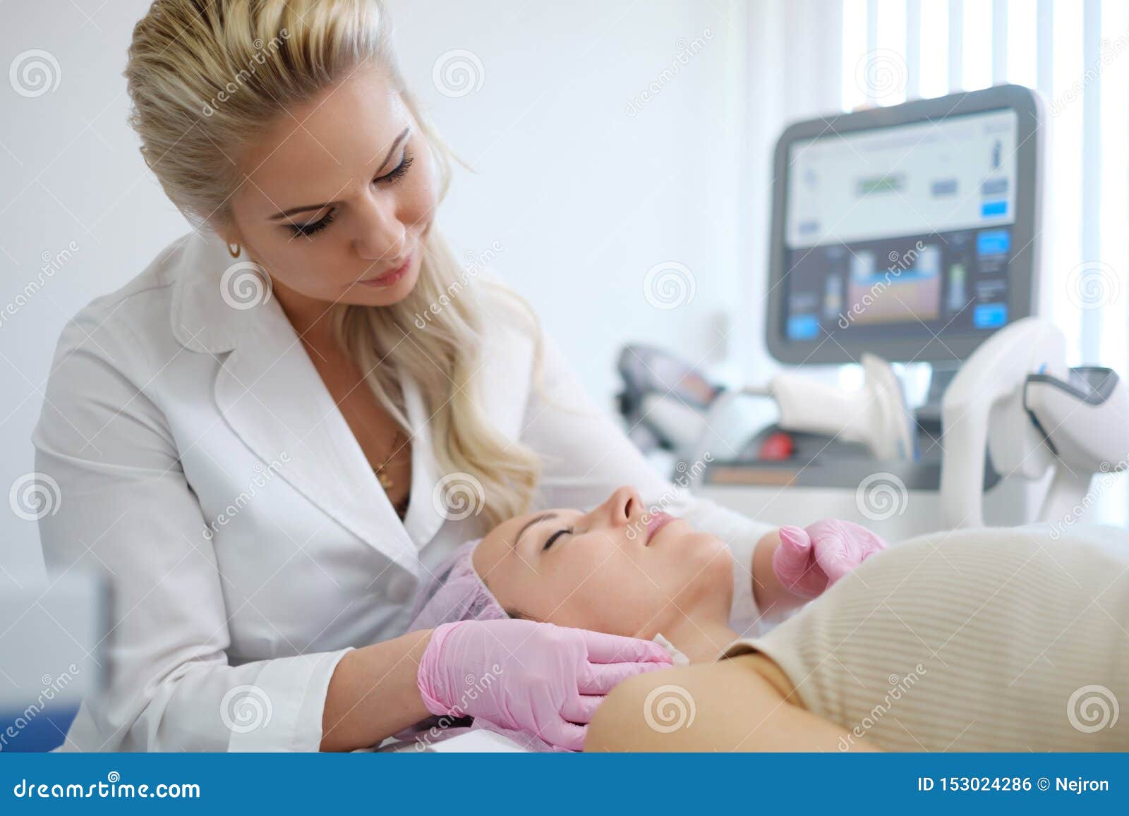 woman getting treatment with aesthetic dermatology device