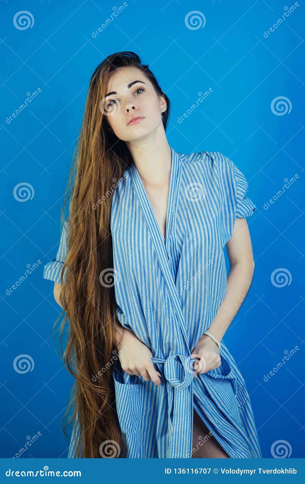 A Young Cute Girl In A White Dress Poses Beautifully Positive Attitude  Stock Photo - Download Image Now - iStock