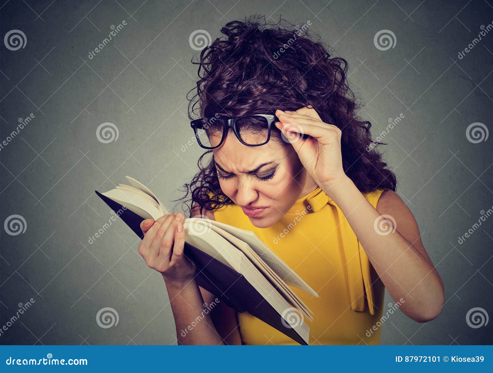 Woman with Glasses Reading Book Has Eyesight Problems Stock Image