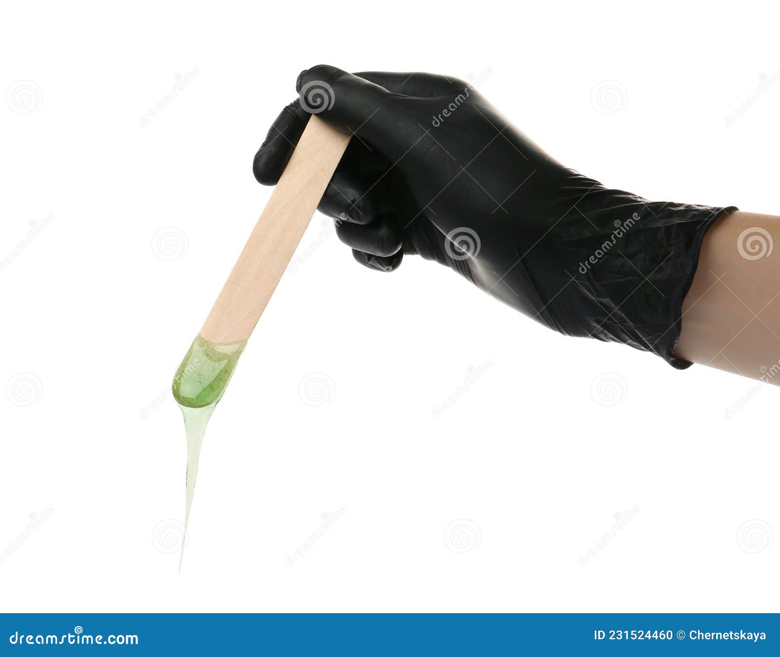 woman in gloves holding spatula with hot depilatory wax on white background, closeup