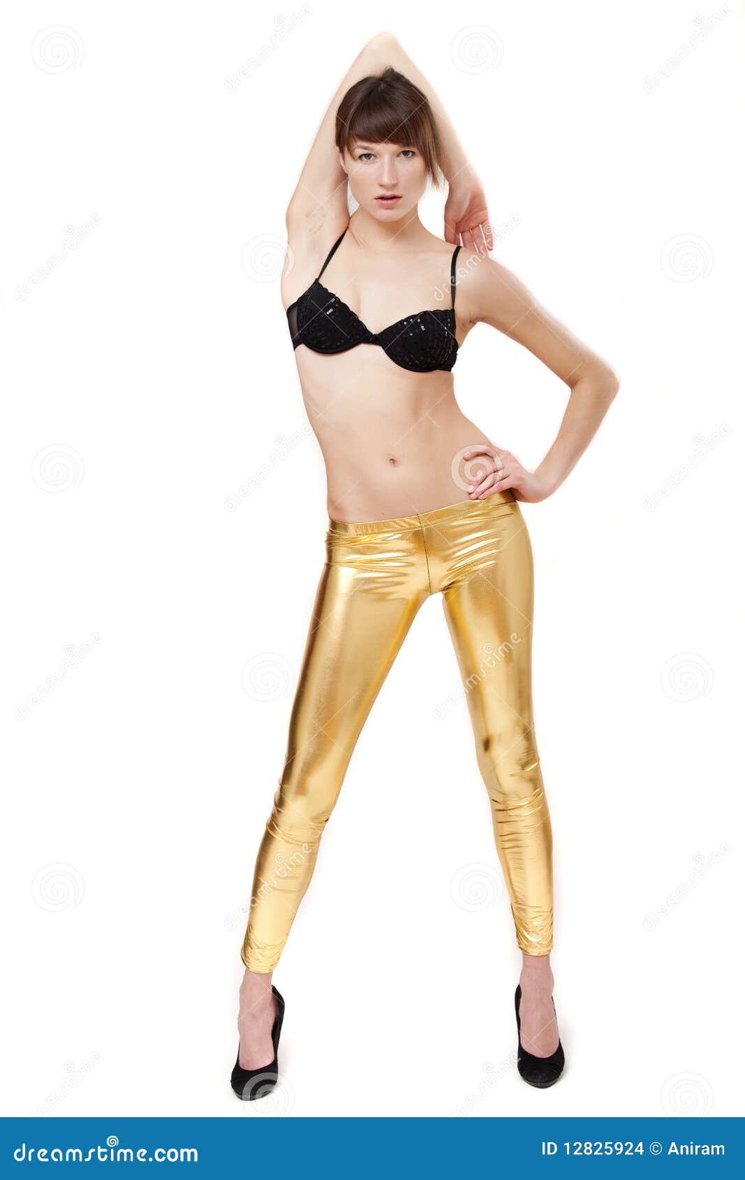 Woman in gold leggings stock photo. Image of clothing - 12825924
