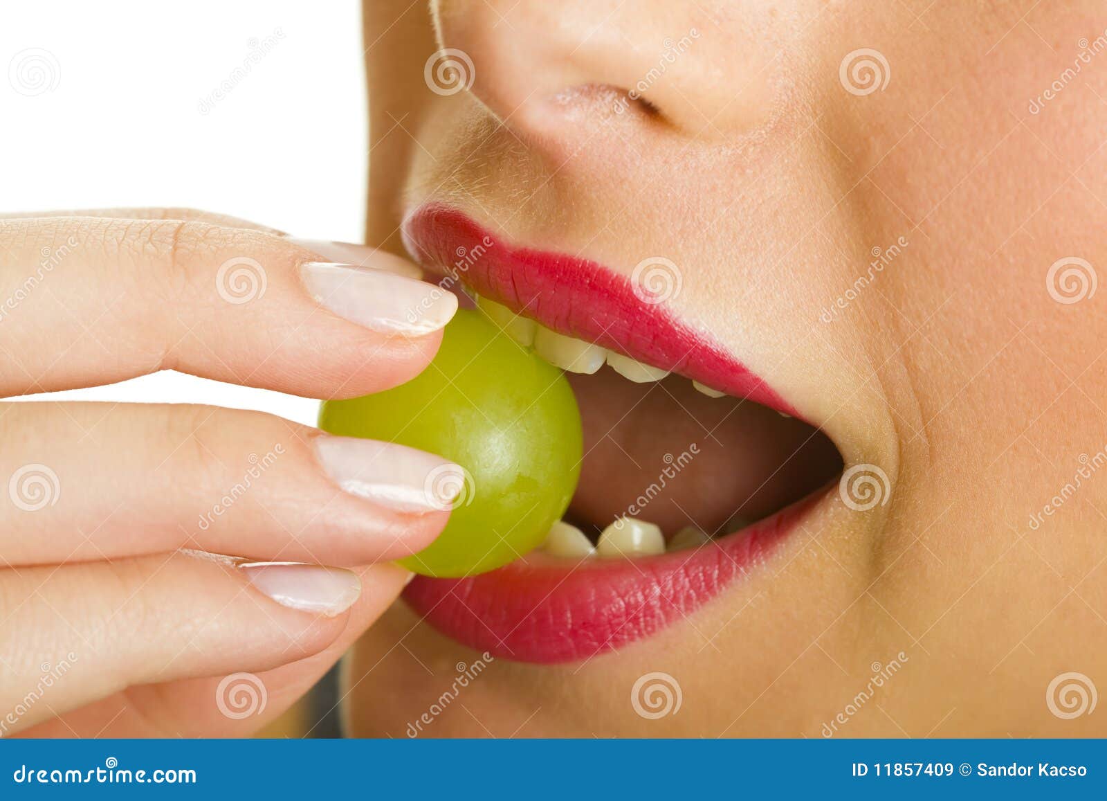 Woman with grape in mouth stock image. Image of healthy 11857409