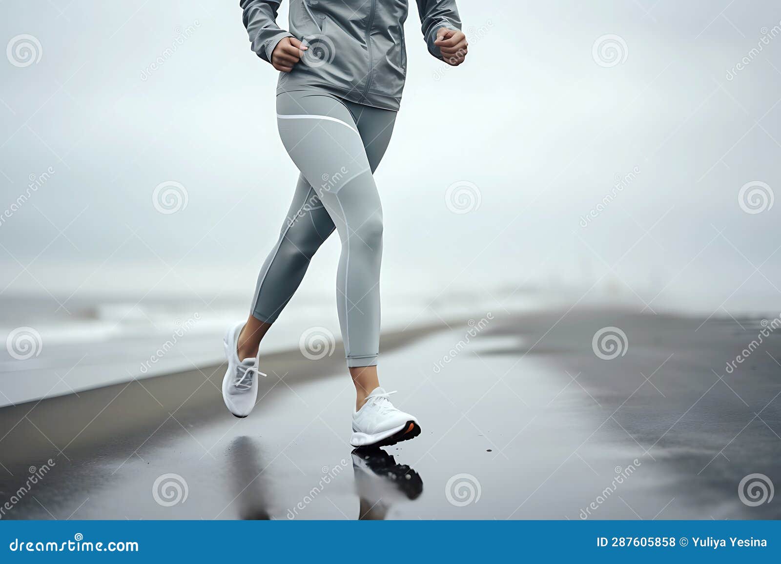 Woman in a Gray Tracksuit Jogging Along the Seashore in Cloudy Foggy ...