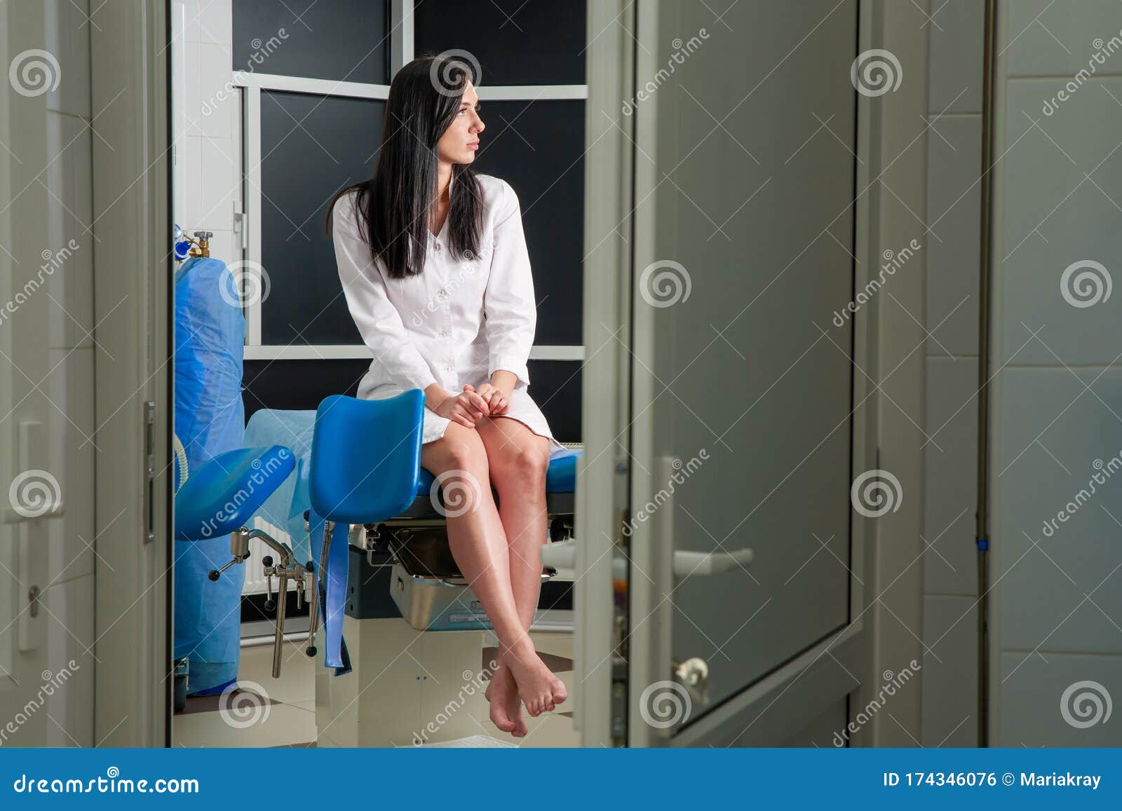 Woman At Gynecologist Office Sitting And Waiting For A Doctor With Test