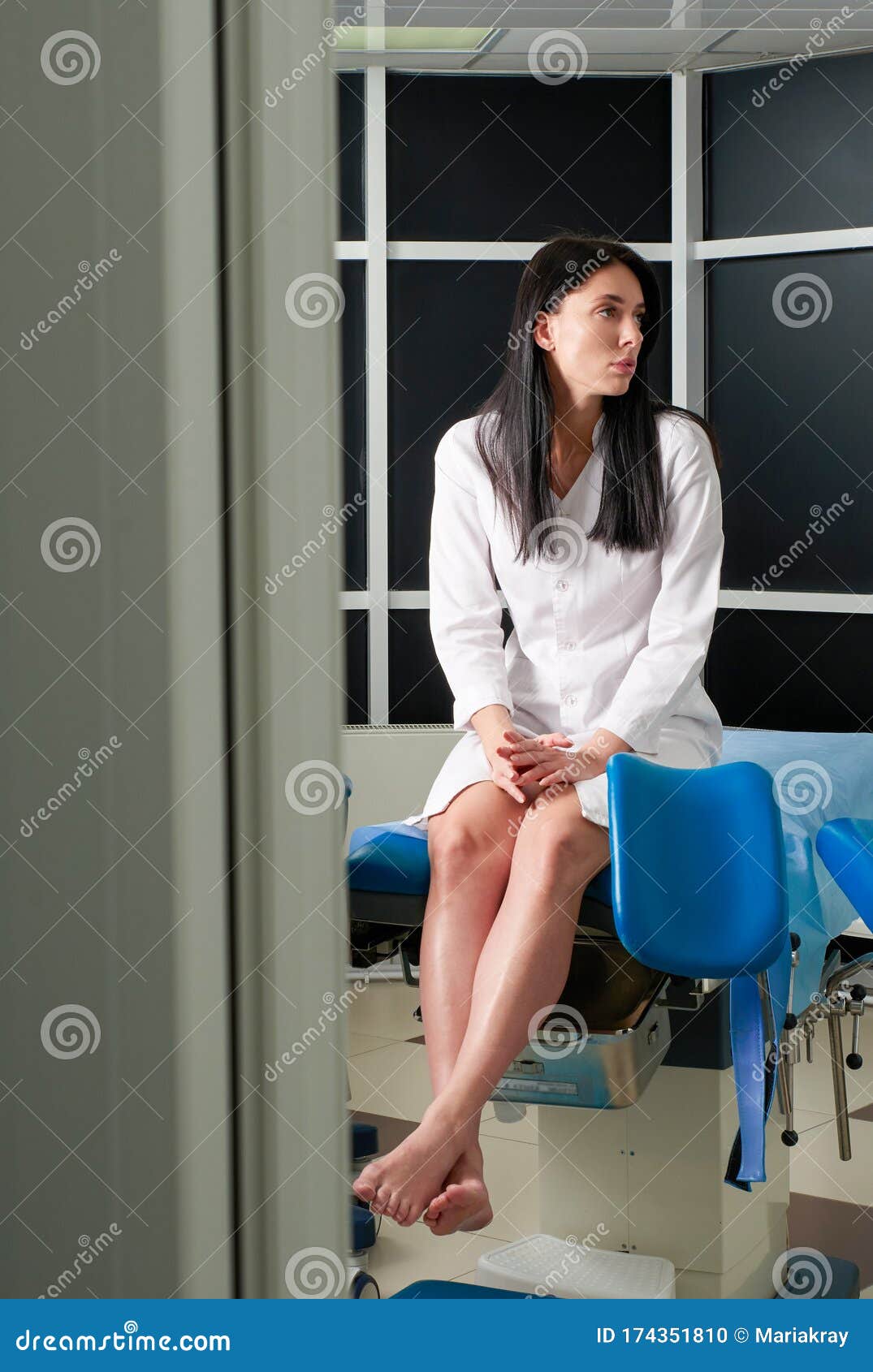 Woman At Gynecologist Office Sitting And Waiting For A Doctor With Test