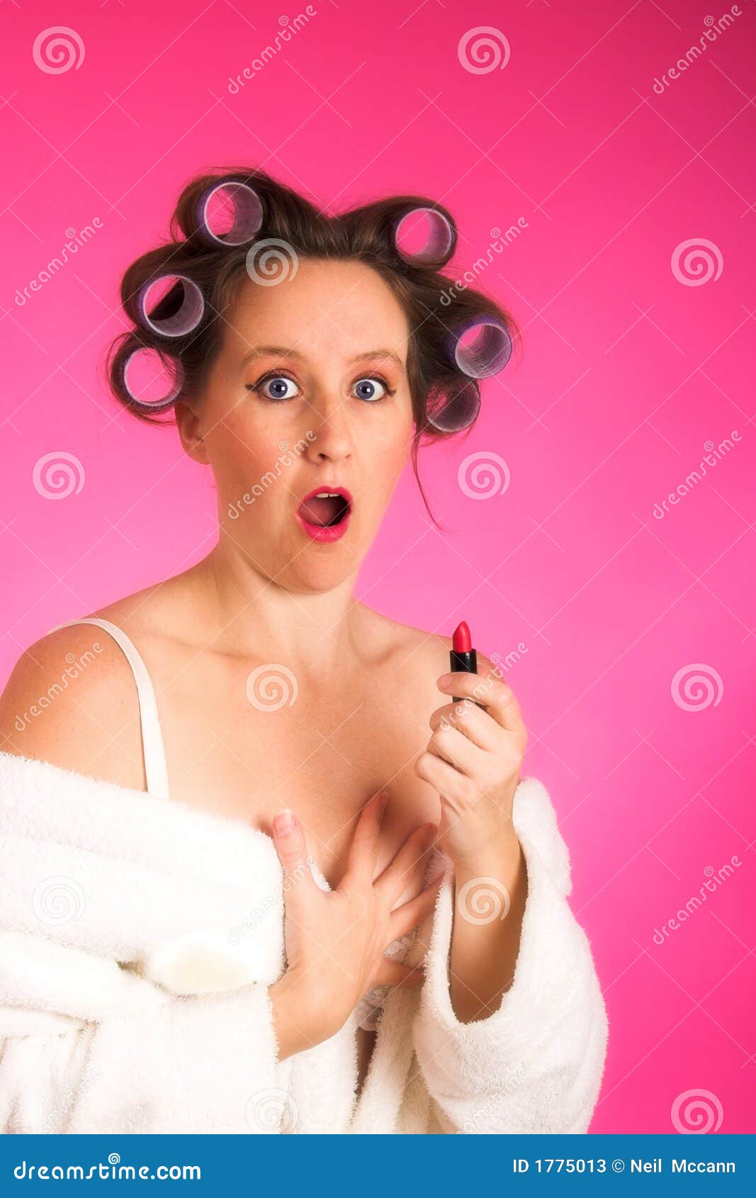 woman in hair rollers and robe