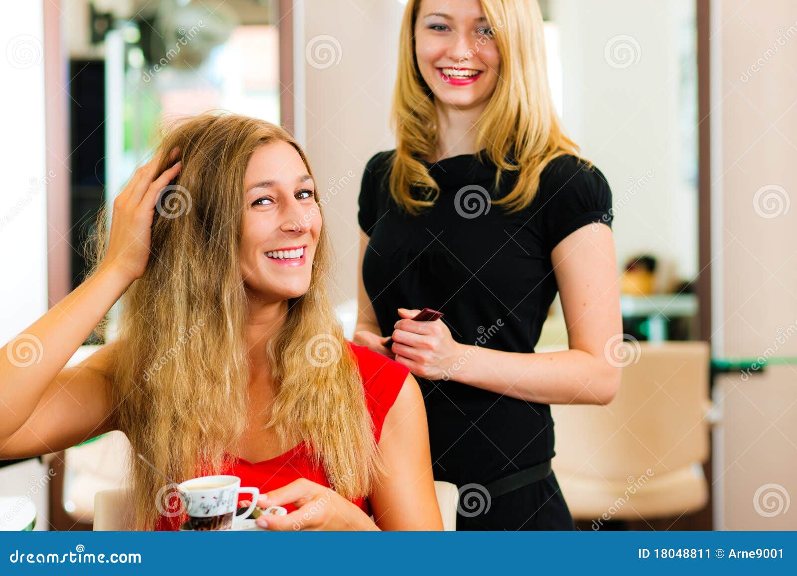 woman at the hairdresser getting advise